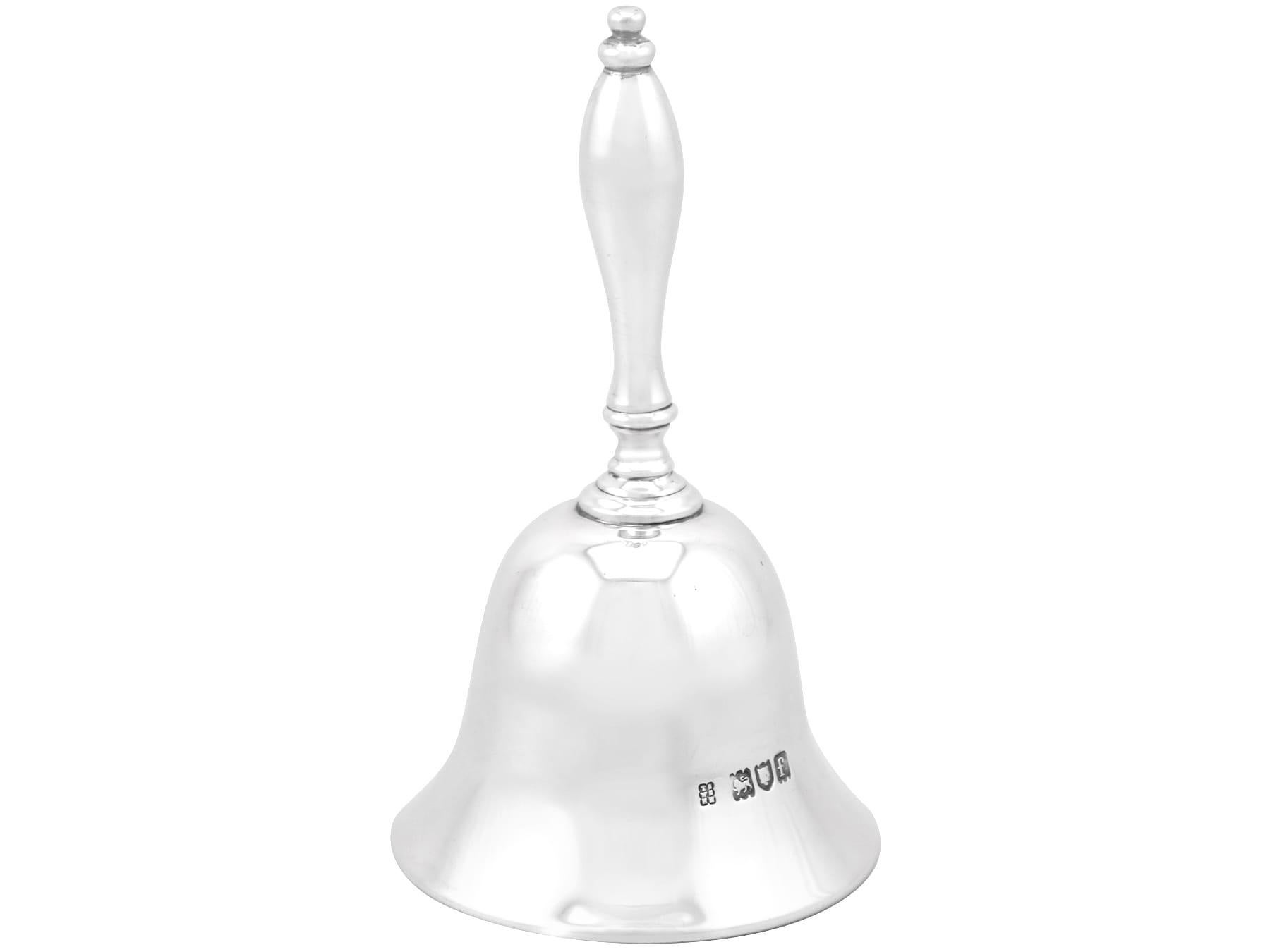 An exceptional, fine and impressive antique Edwardian English sterling silver table bell; an addition to our range of ornamental silverware

This exceptional antique Victorian cast sterling silver table bell has a plain bell-shaped form.

The