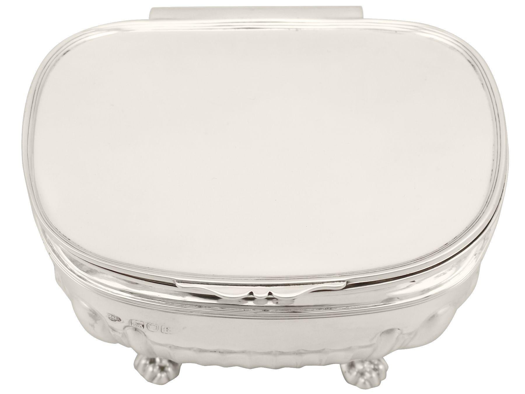 An exceptional, fine and impressive antique Edwardian English sterling silver tea caddy made in the Regency style; an addition to our silver teaware collection

This exceptional antique Edwardian sterling silver tea caddy has a rounded rectangular