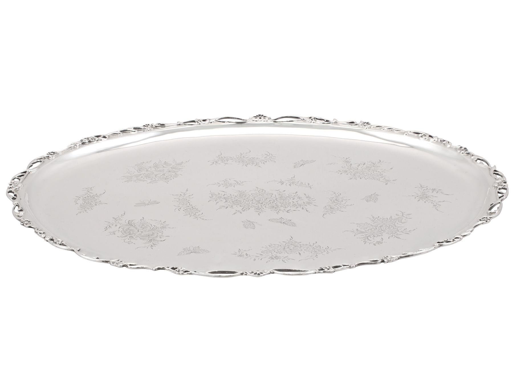 An exceptional, fine and impressive antique Edwardian English sterling silver tray; an addition to our silver tray collection.

This exceptional, fine and impressive antique Edwardian sterling silver tray has an oval form.

The surface of this