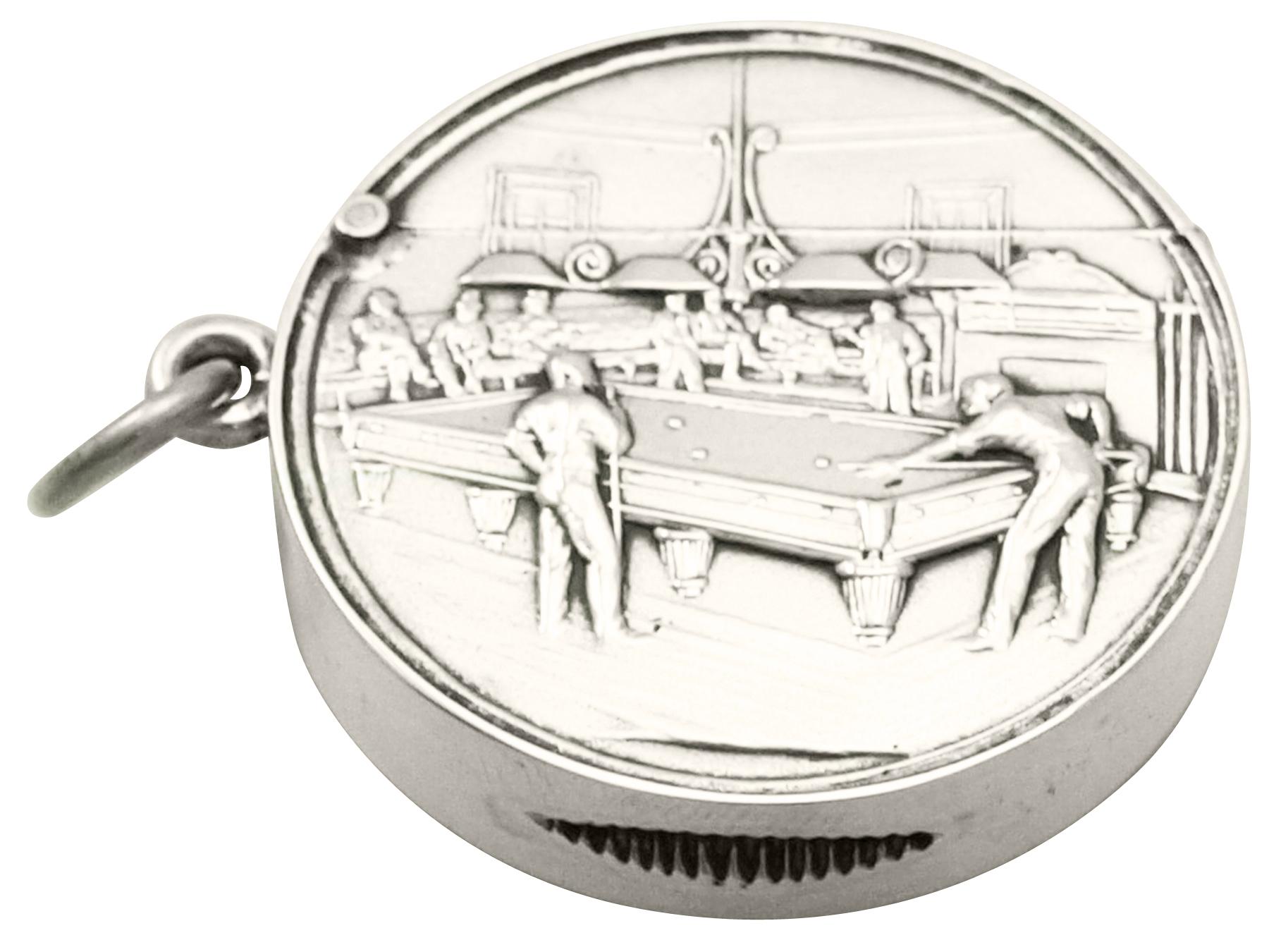 A fine and collectable antique Edwardian English sterling silver vesta case with billiard interest, an addition to our sports related silverware collection.

This fine Edwardian sterling silver vesta case has a plain circular form.

The anterior