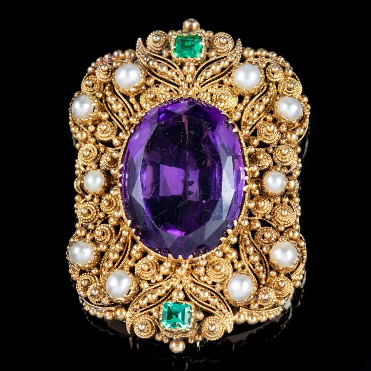 A fabulous antique Edwardian Suffragette brooch adorned with white Pearls, two green Emeralds and an impressive violet Amethyst which is approx. 18ct. Suffragette jewellery was worn to show one’s allegiance to the women’s Suffragette movement in the
