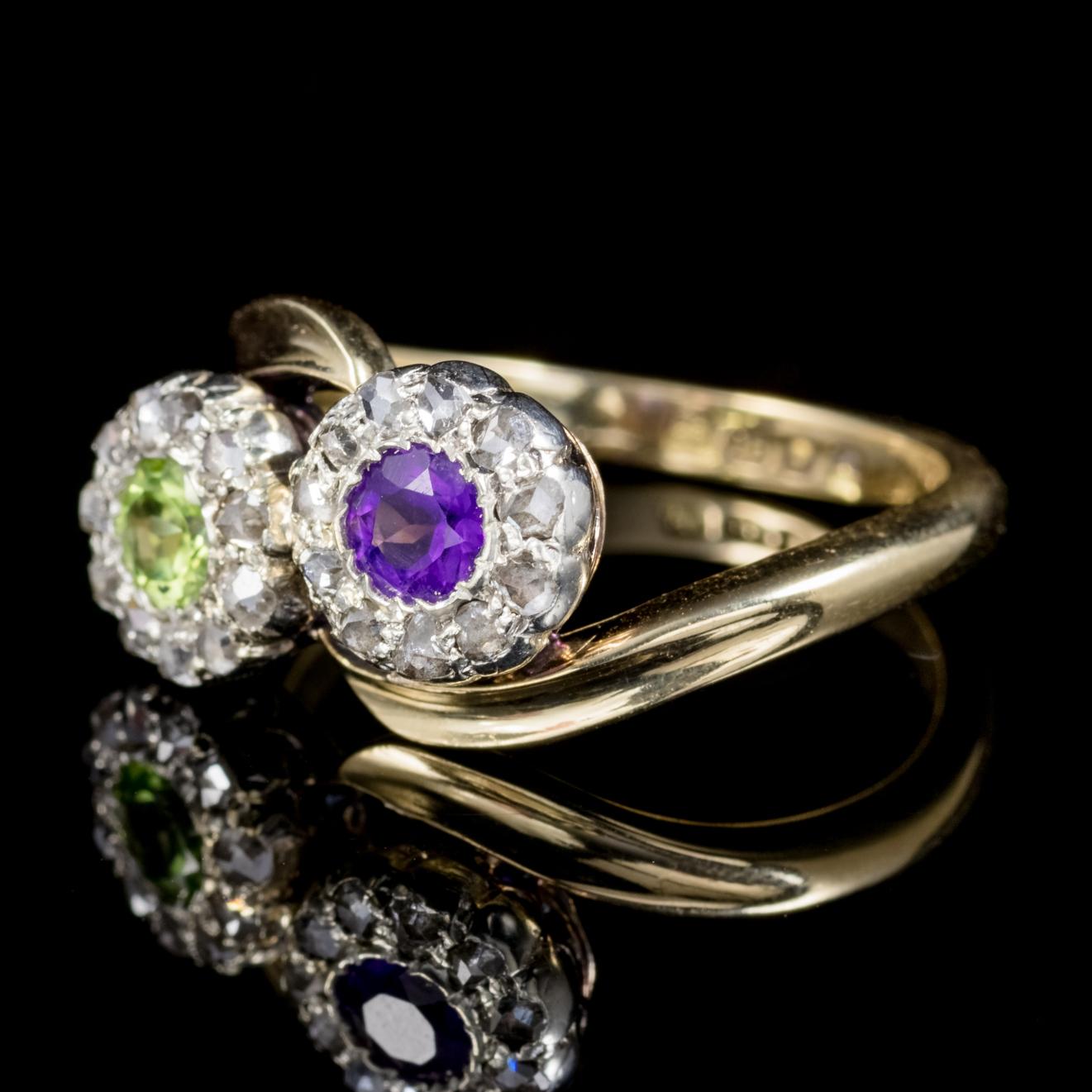 This pretty antique Edwardian ring was designed to represent the Suffragette movement and is fully hallmarked and dated London 1910. 

The front of the ring features a lovely violet 0.22ct Amethyst accompanied by a green 0.22ct Peridot in a lovely