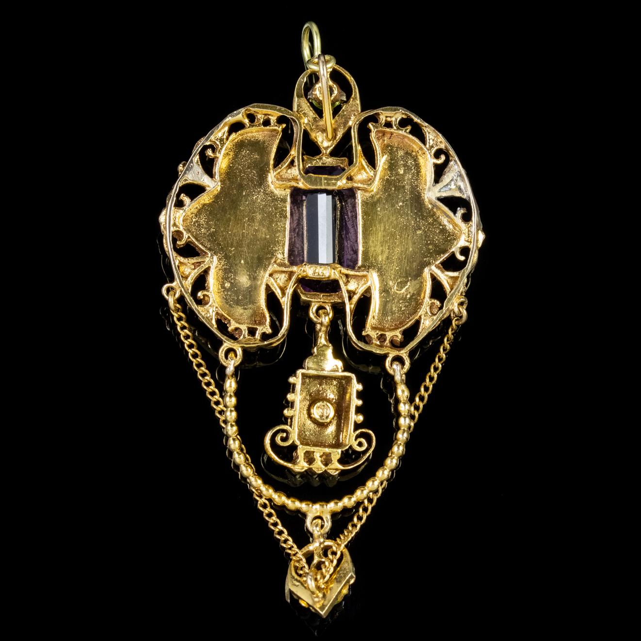 This exquisite antique Edwardian Suffragette pendant is decorated with Pearls and Peridots with an impressive clear violet Amethyst crowned in the centre.

Suffragette jewellery was worn to show one’s allegiance to the women’s Suffragette movement