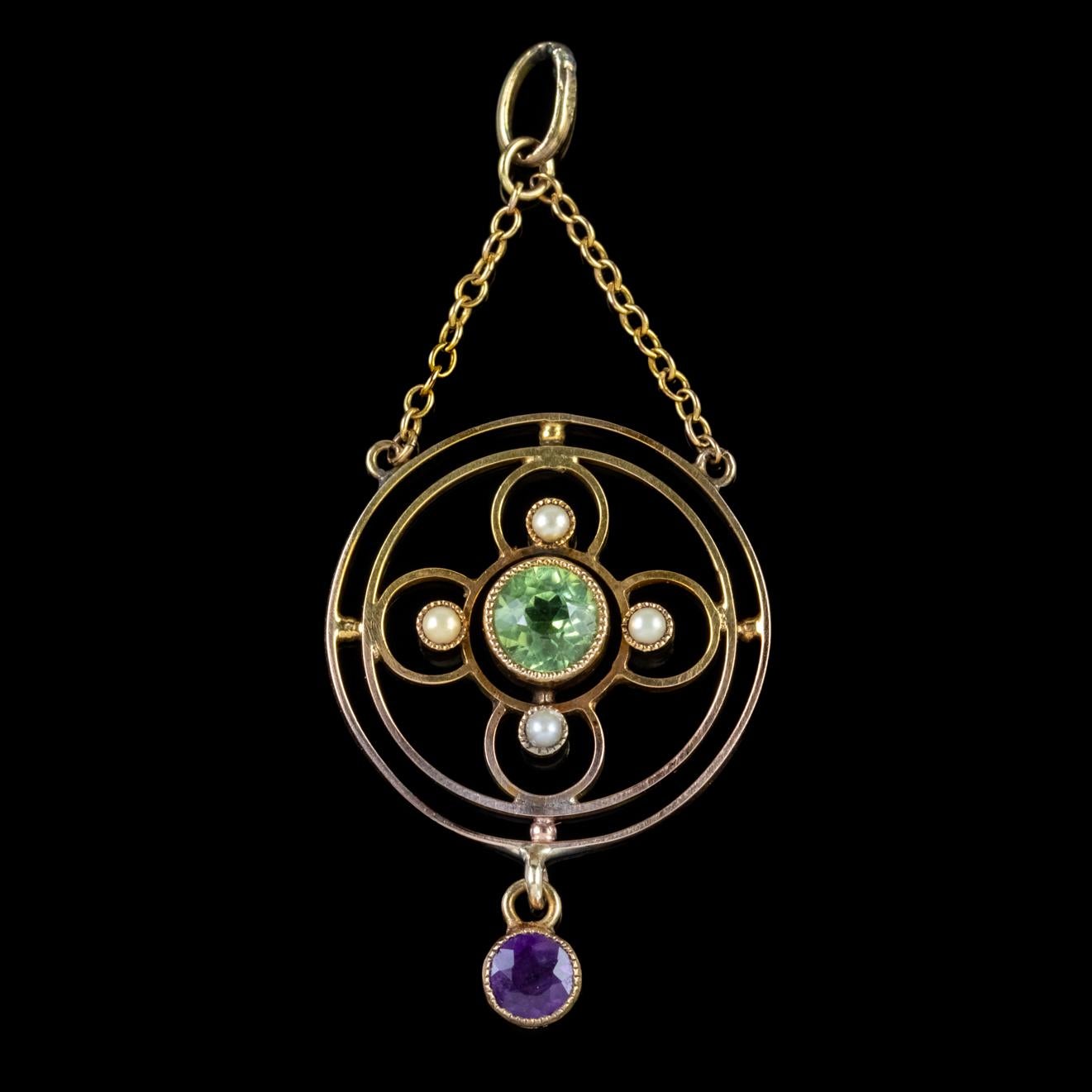 A beautiful antique Edwardian Suffragette pendant featuring a 0.45ct Peridot in the centre haloed by four Pearls with a fabulous 0.20ct Amethyst dropper dangling below. 

Suffragette jewellery was worn to show one’s allegiance to the women’s