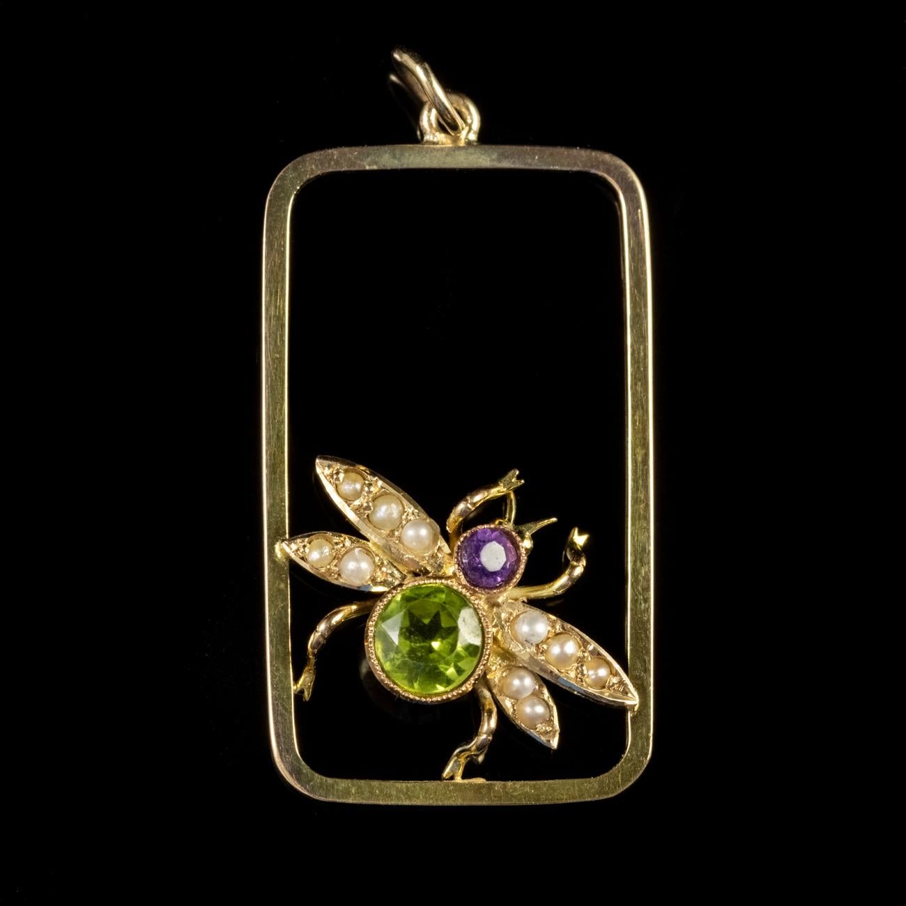This delightful Antique Edwardian Suffragette pendant has been modelled in 9ct Yellow Gold and features the form of bee. The body of the bee is set with a lovely Peridot which weighs approx. 0.50ct and the head of the bee is set with an Amethyst