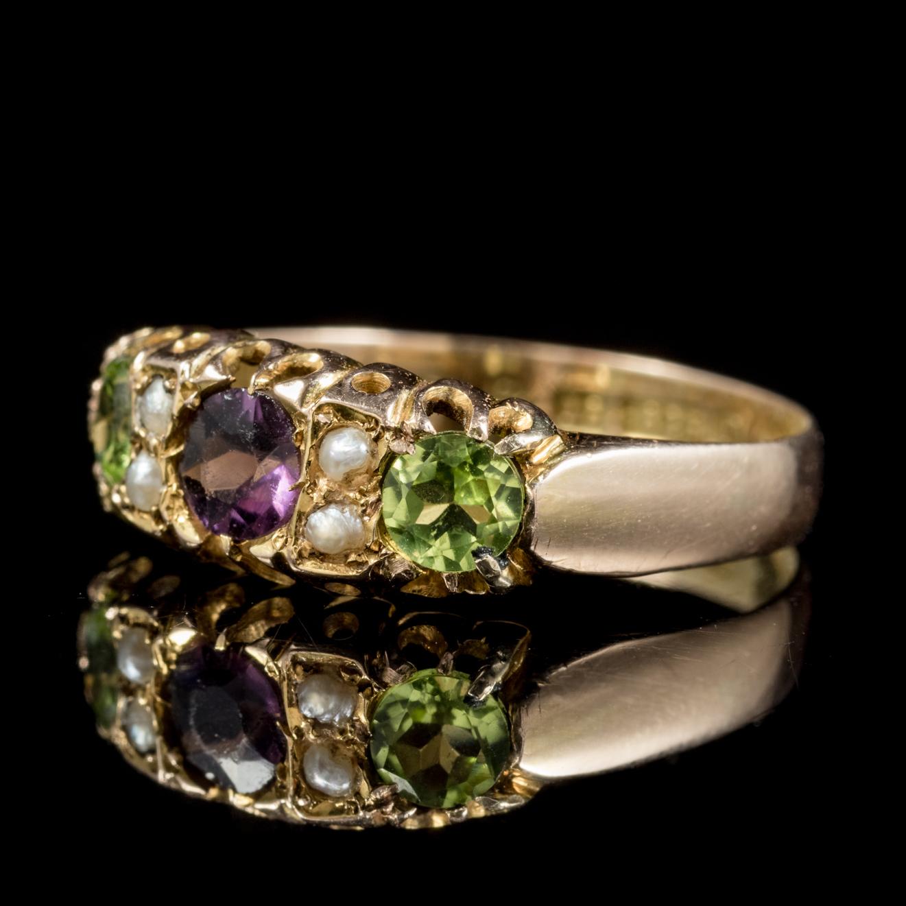 This lovely antique 18ct Gold Edwardian Suffragette ring is dated Chester, 1904. 

The fabulous piece is adorned with two green Peridots, four creamy Pearls and a violet Amethyst in the centre. 

Suffragettes liked to be depicted as feminine, their