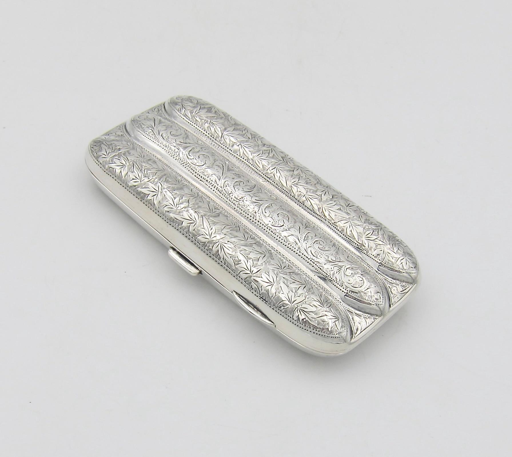An antique Edwardian sterling silver three-tube cigar case from William Aitken of Chester, United Kingdom, date marked for 1901. The elegant hinged case opens with a press catch on one side revealing the original gilded interior. The exterior of the