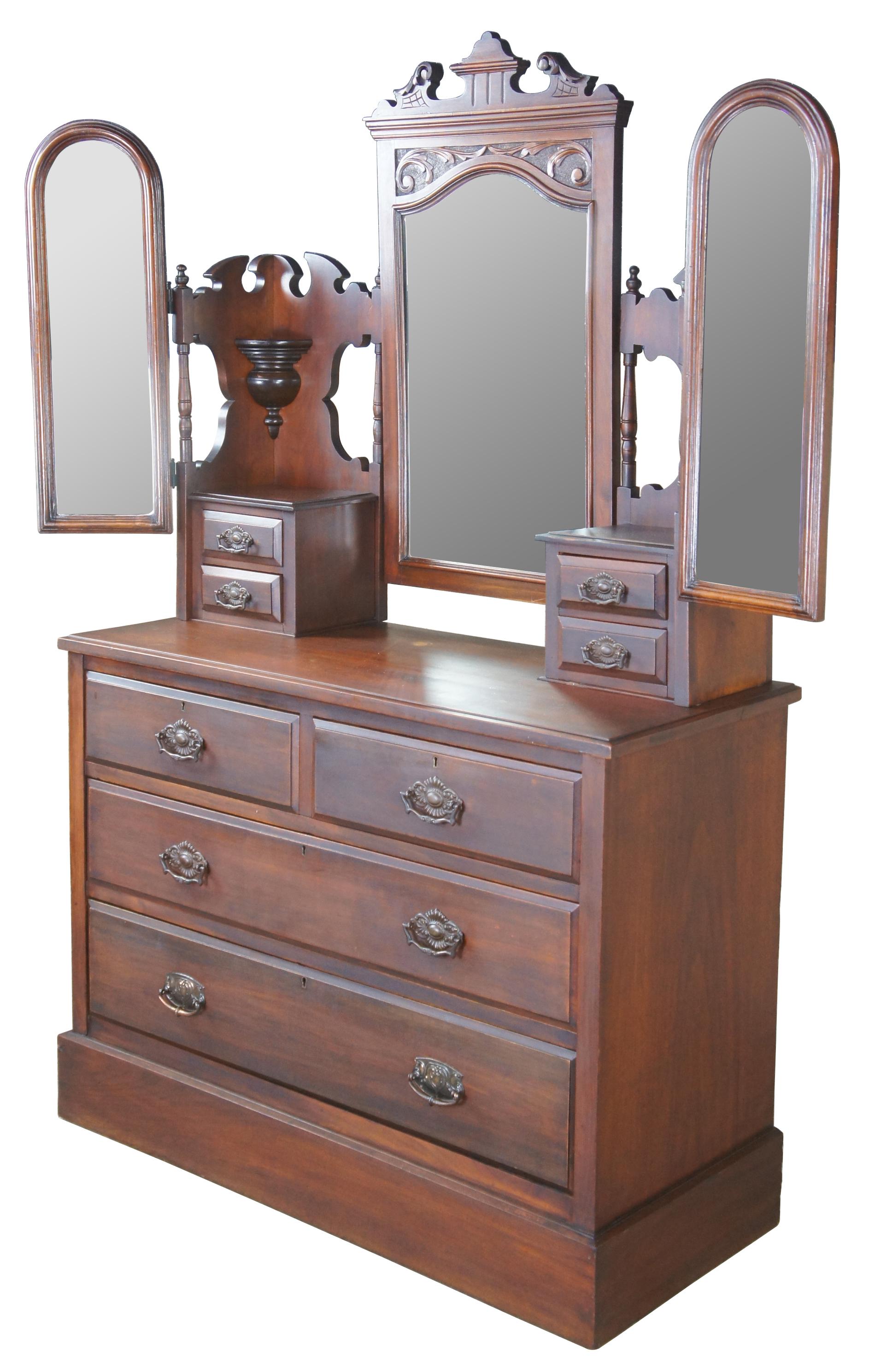 Late 19th century Edwardian English dresser. Made from walnut with three adjustable mirrors. Perfect for shaving and dressing. Includes upper corbels and shelves for display and eight drawers for storage. 

Surface height - 31