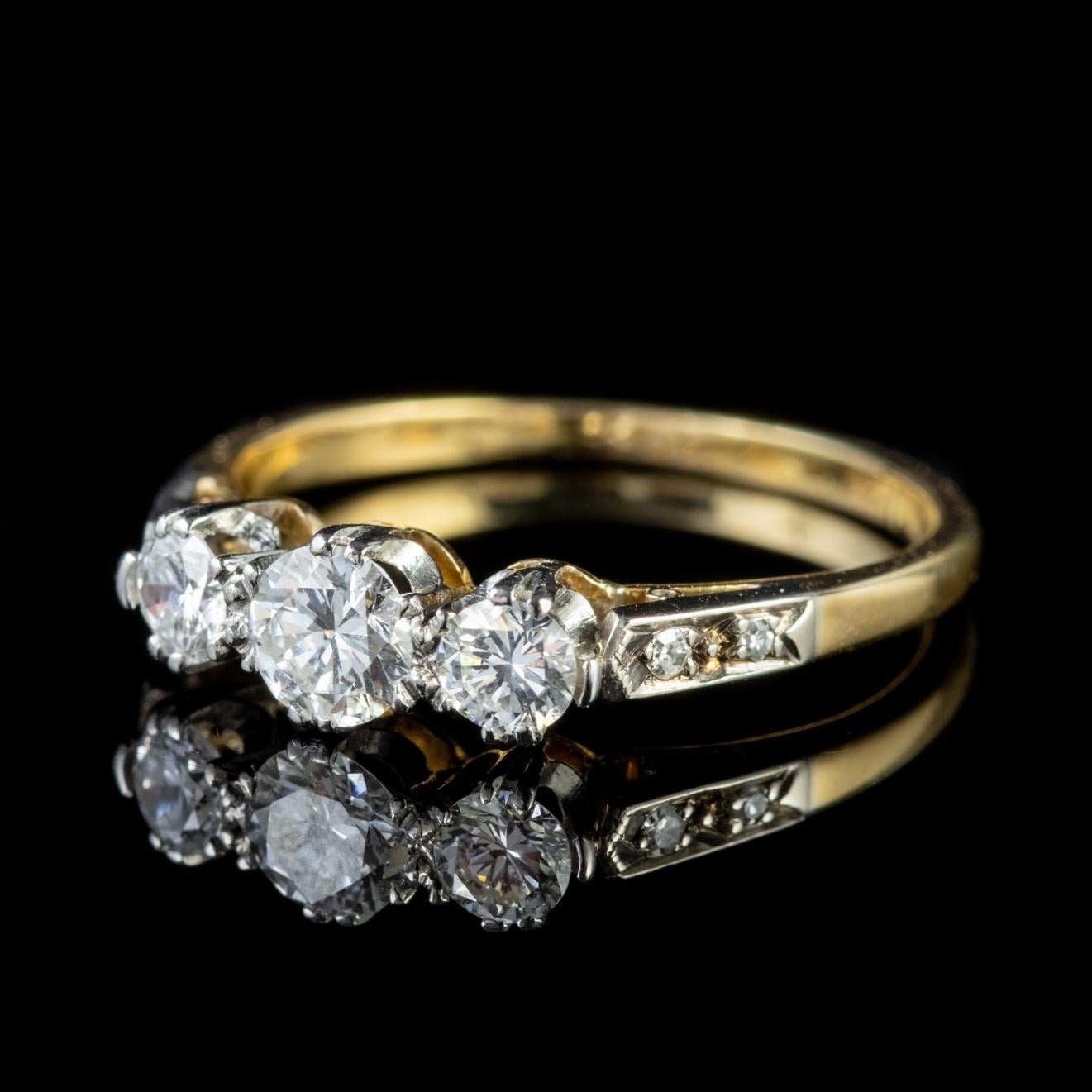 A stunning antique Edwardian ring adorned with a trilogy of high quality VS1 clarity old brilliant cut Diamonds which represent past, present and future or those 3 little words - I  love you.

The central stone is 0.40ct flanked by two 0.20ct stones