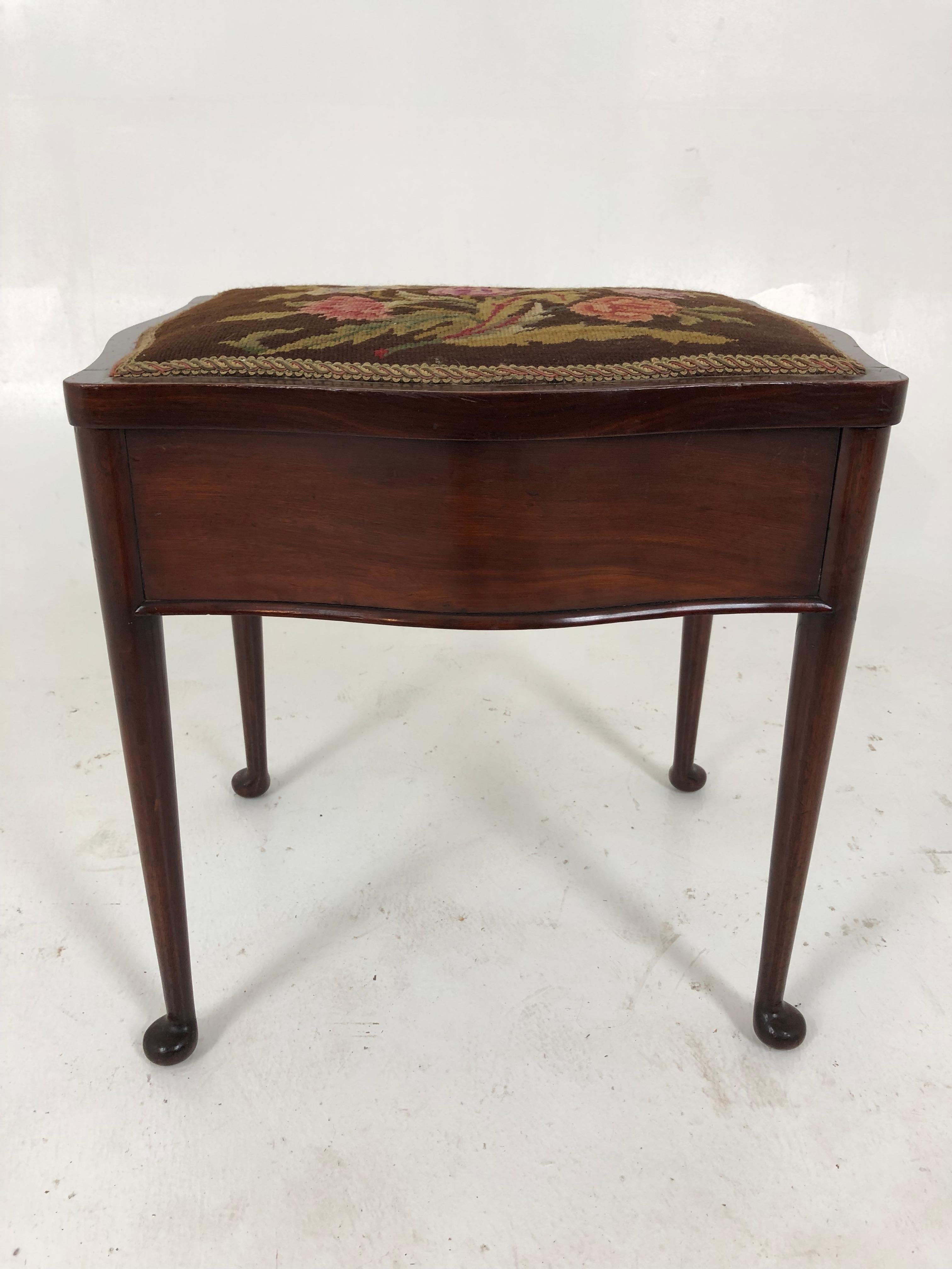 Antique Edwardian walnut piano stool, bench, Scotland 1920, H796

Scotland 1920
Solid walnut 
Original finish
Upholstered seat
The stool has a lift up padded seat with a needle point covering 
Finished on all sides
All supported by cabriole style