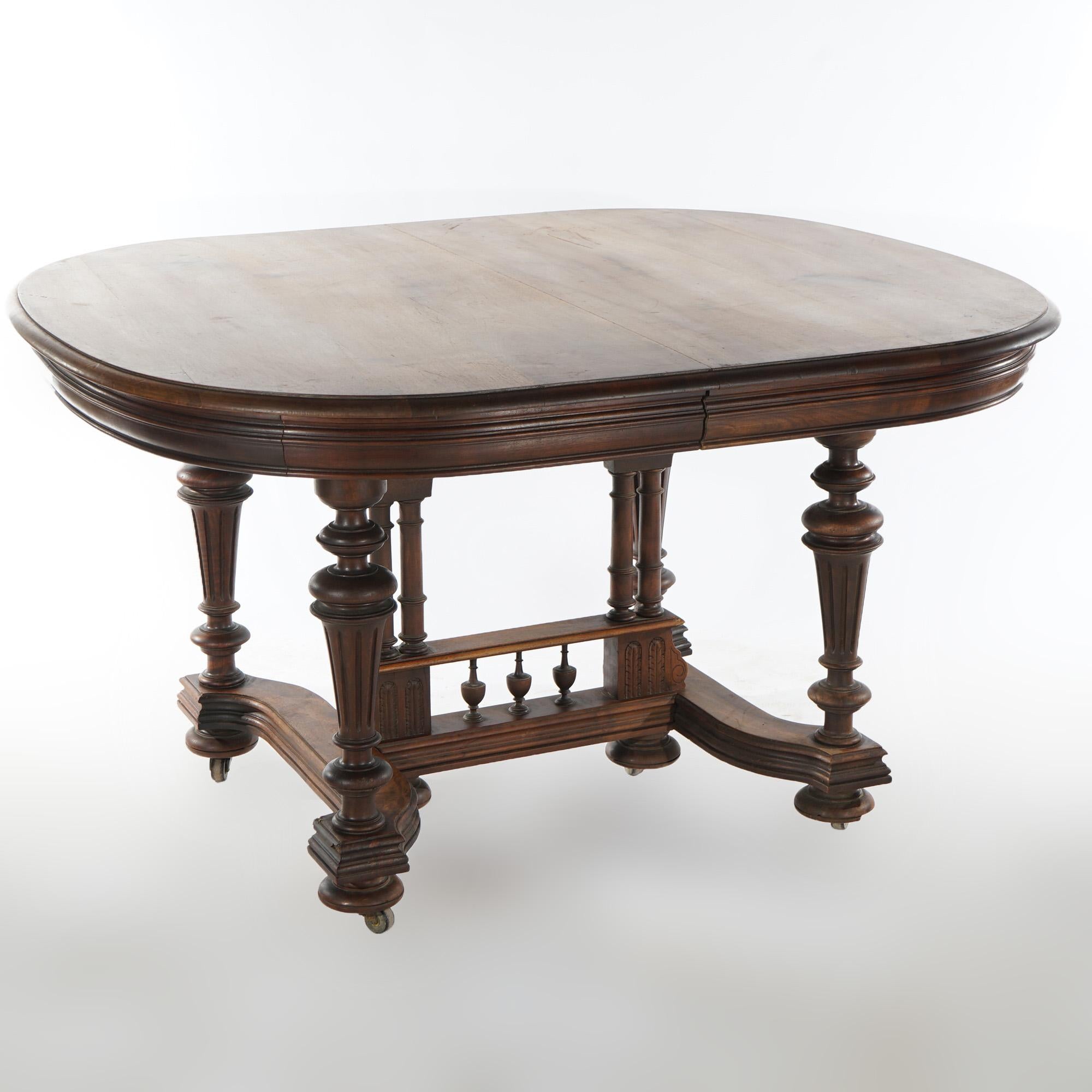 An antique Edwardian extension dining table offers walnut construction with square top raised on balustrade legs and accepting three leaves, c1900

Measures - 29