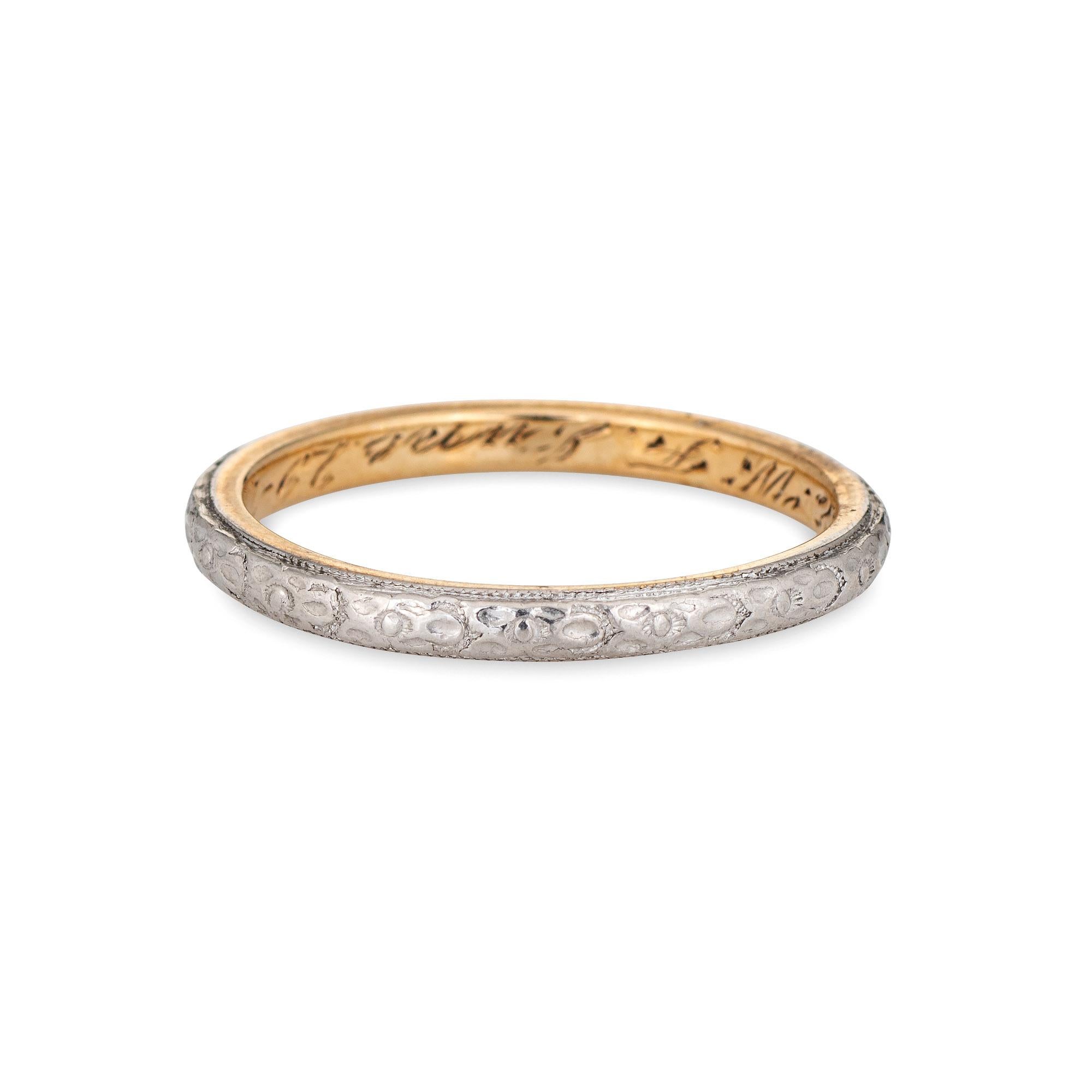 Finely detailed antique Edwardian era wedding band (circa 1914) crafted in platinum & 14k yellow gold. 

The charming Edwardian era ring features a flower pattern, continuous around the band. The ring would make a lovely vintage alternative wedding