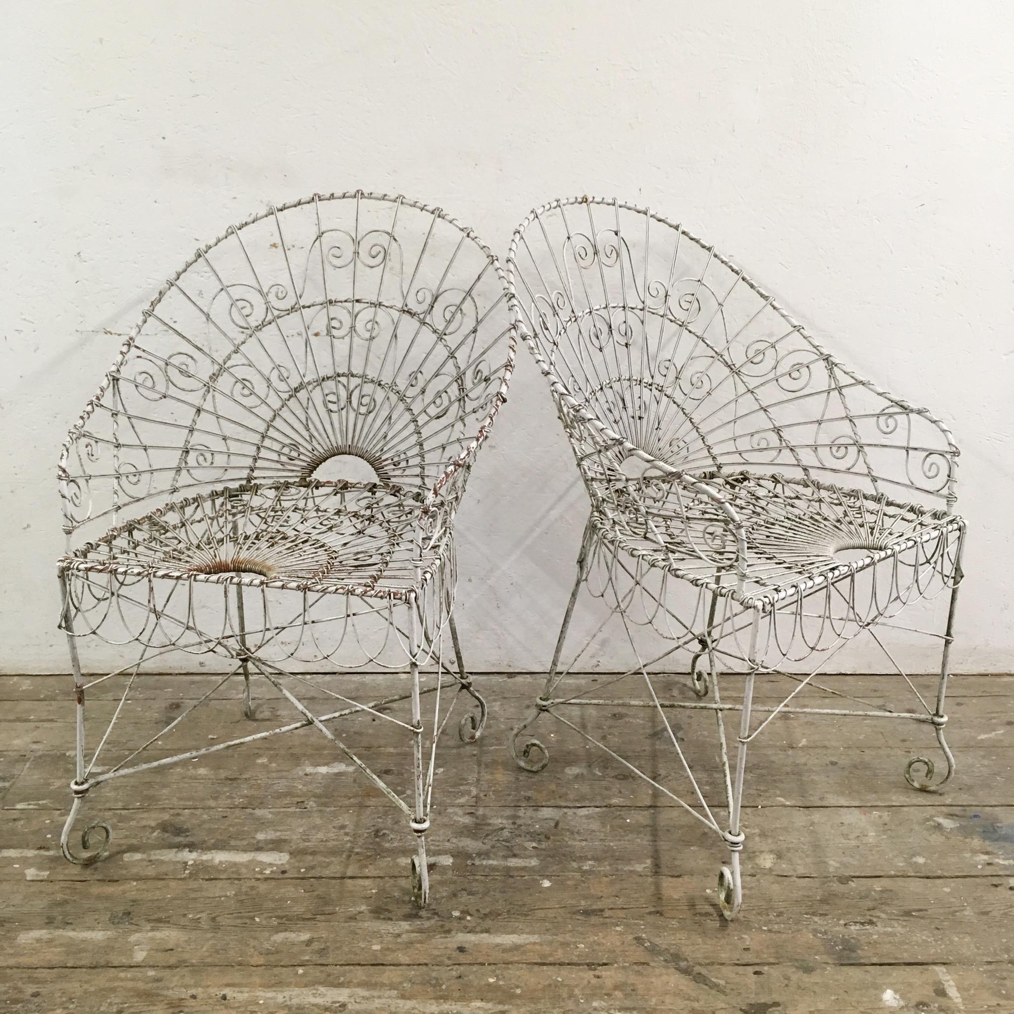 A beautiful pair of Edwardian wire work garden chairs, circa 1910. Stunning detailing and scalloped edge skirt. Great condition, no missing pieces or breaks. Price is for the pair.

Measures: 88cm height
58cm width
52cm depth
46cm seat height.