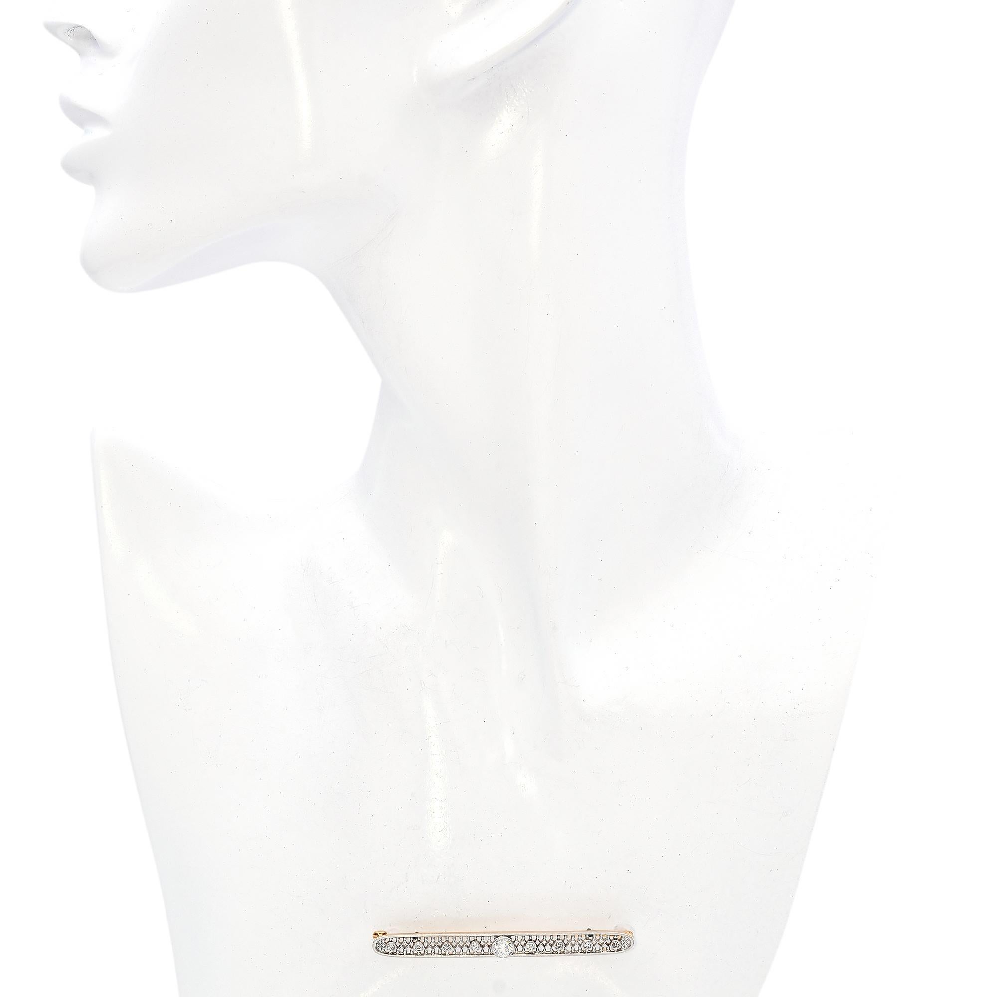 Featuring a central round diamond, surrounded by a series of smaller diamonds, this brooch is a testament to refined craftsmanship. The intricate openwork design adds a touch of sophistication, allowing light to dance through the piece.

Weight: 4.7