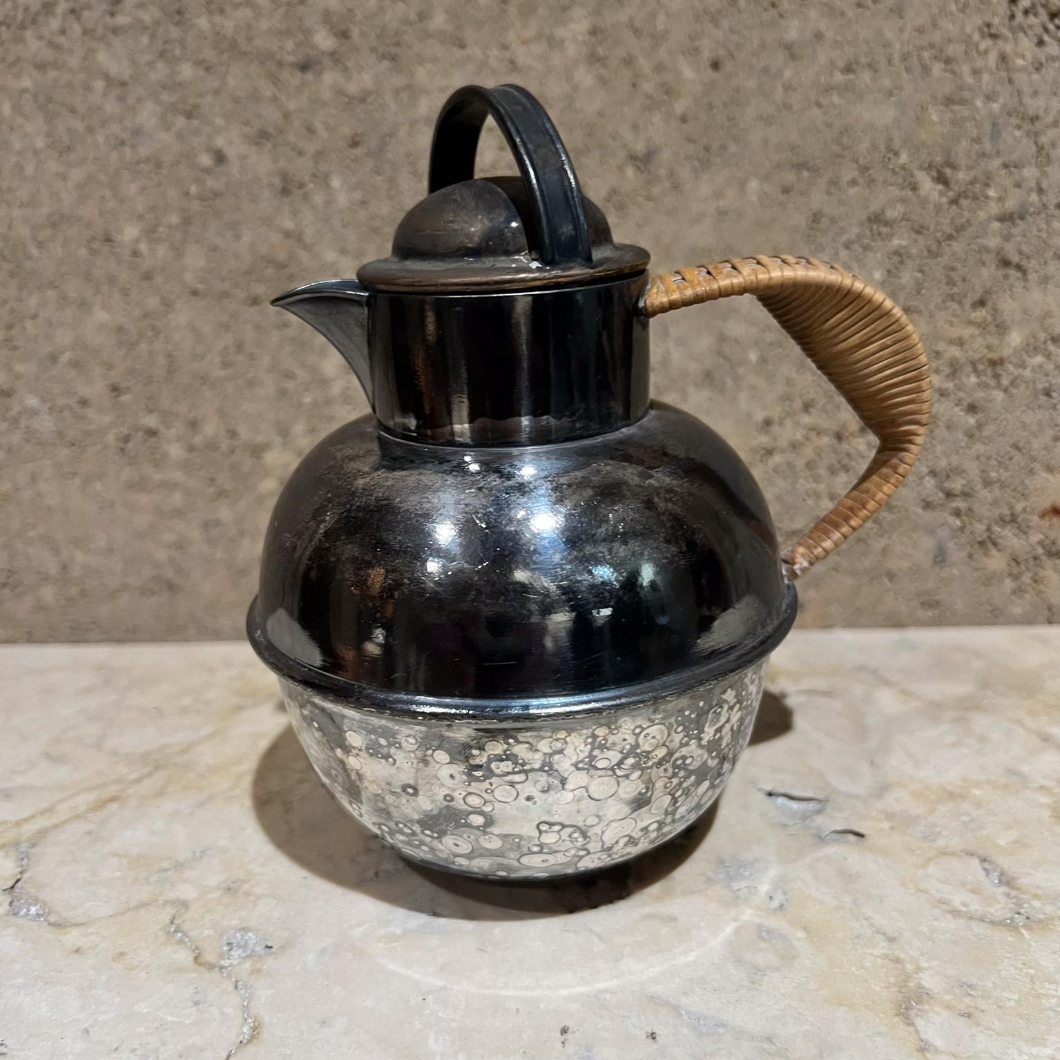 Antique E.G. Webster & Son (c 1886-1928) Silver Plate Creamer Jug or Individual Tea Pot.
International Silver Company
Handle that is wrapped in rattan.
Stamped EGW&S
6 h x 4 diameter x 5 d
Vintage wear present discoloration.
Refer to all images.