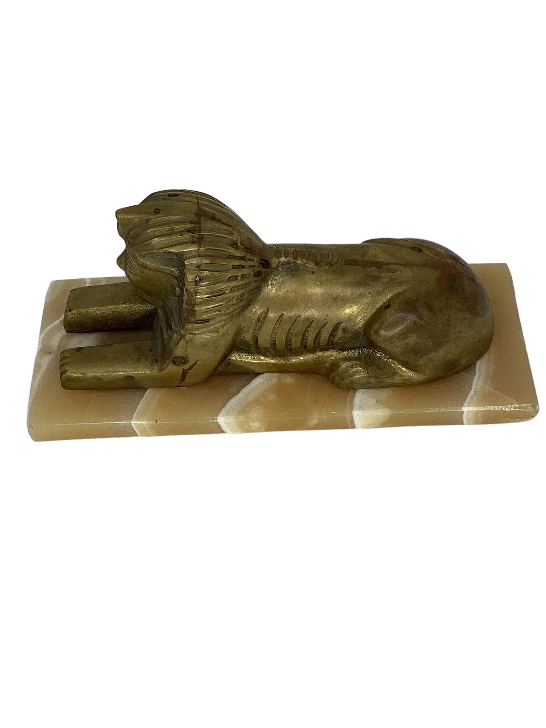 Antique Egyptian Brass Sphinx on Onyx Base.