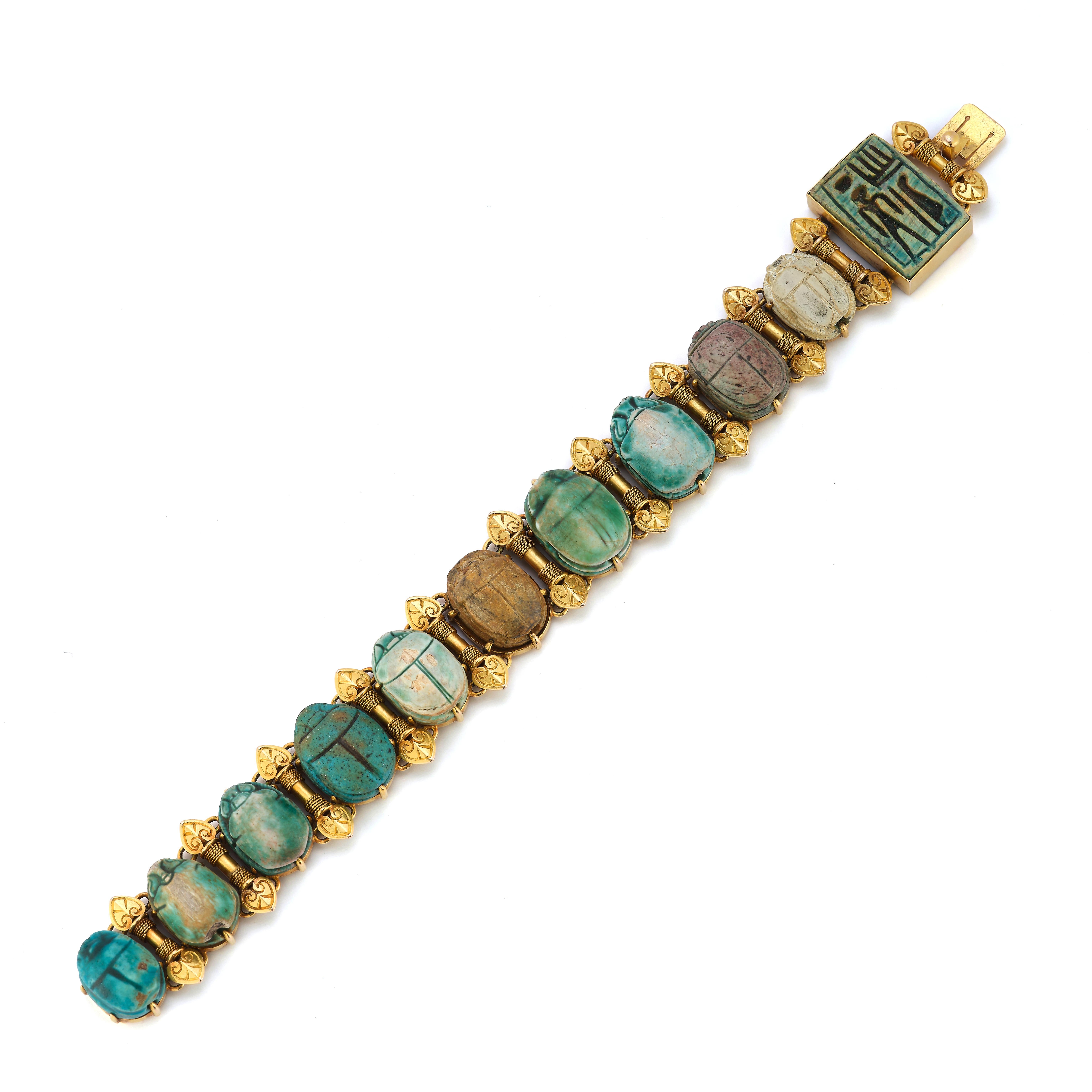 Egyptian Revival Faience Scarab Bracelet

11 links of multi color carved Egyptian faience scarabs set in gold

Measurements: 6.5