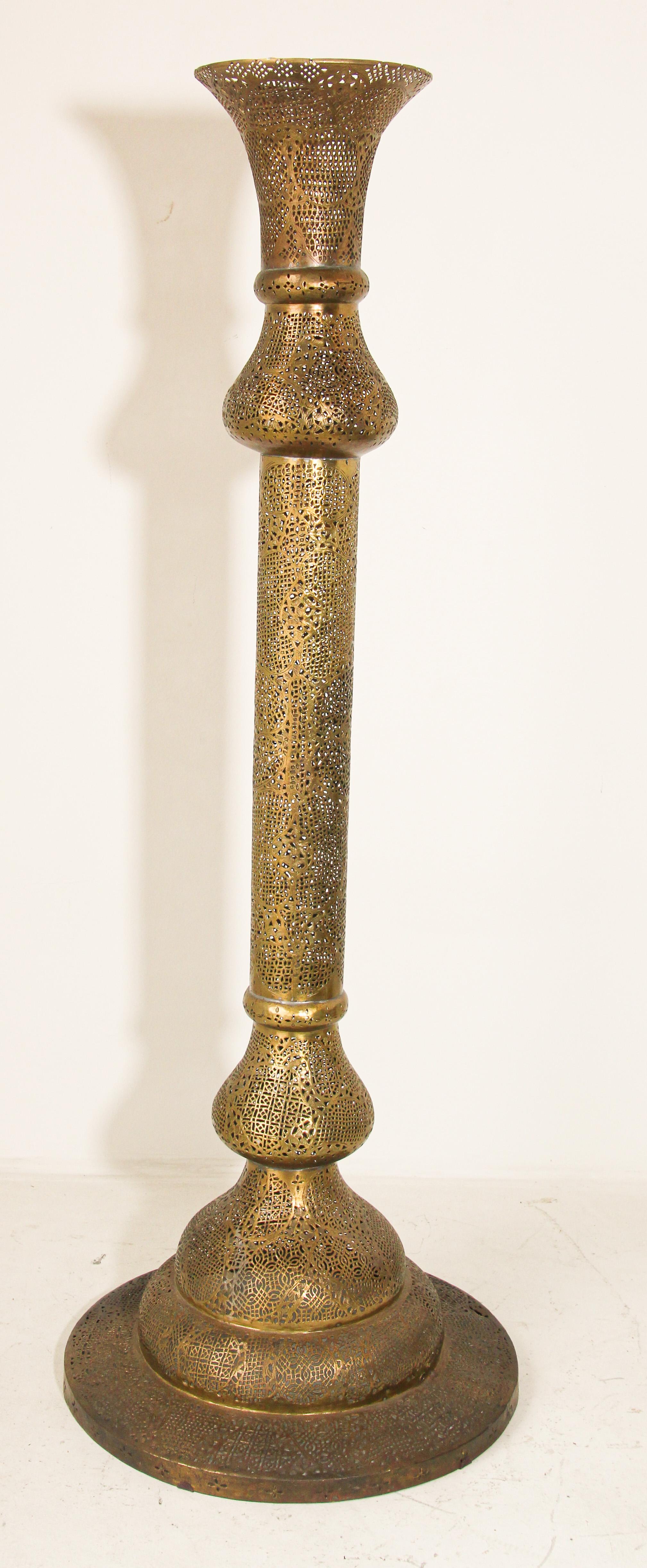 Extremely fine antique 19th century Moorish Egyptian Islamic floor candlestick in brass with Kufic Moorish revival pierced foliate openworks chased and chiseled with Persian calligraphy.
Antique 19th century or earlier Middle Eastern Egyptian Arabic