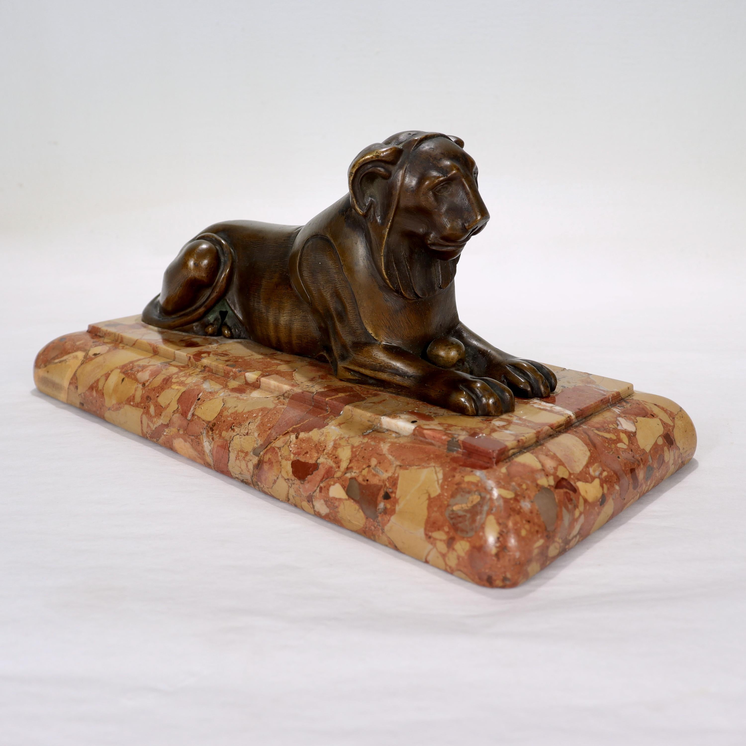 Antique Egyptian Revival Bronze Sculpture of a Lion on a Marble Plinth In Good Condition For Sale In Philadelphia, PA