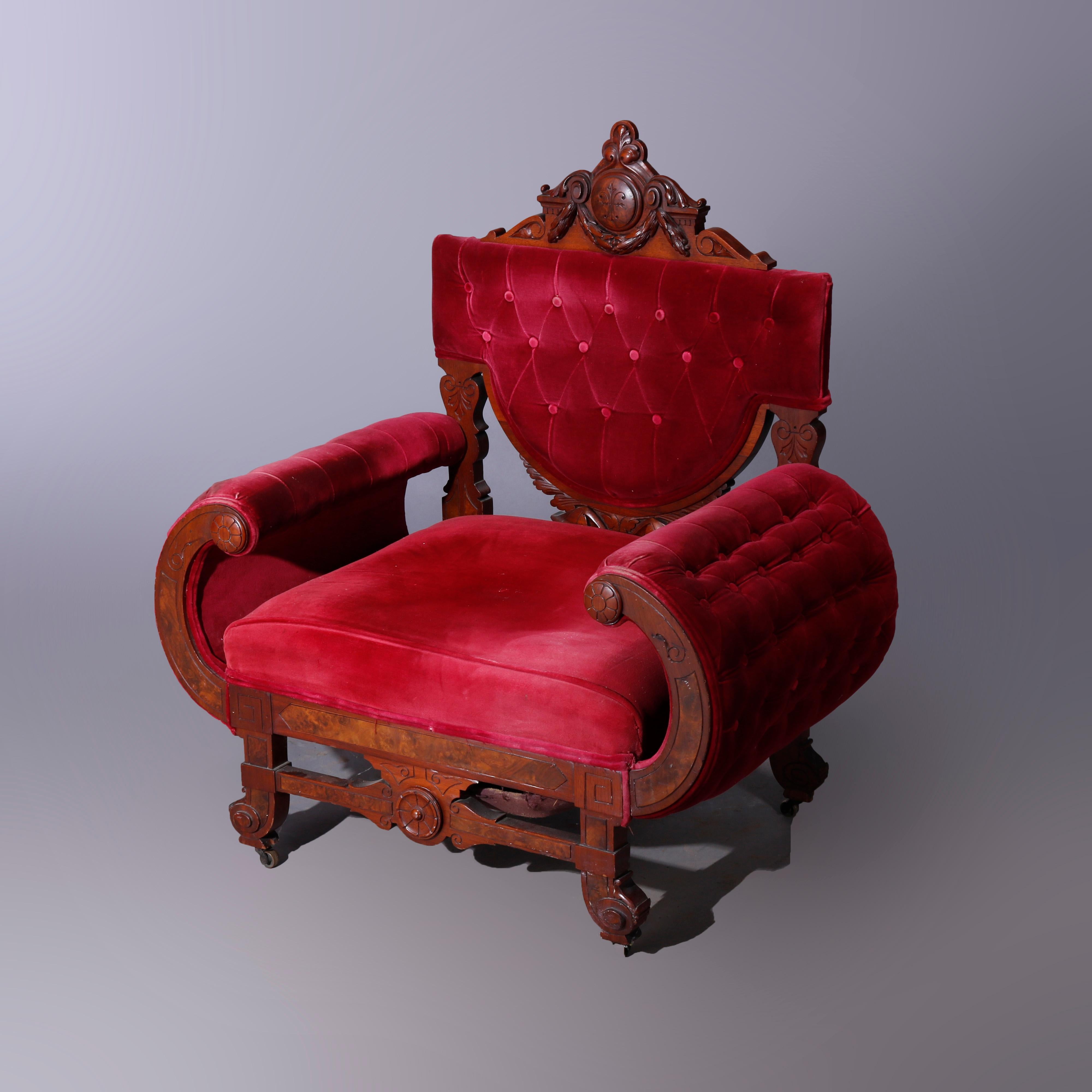 An antique Egyptian Revival throne chair offers walnut and burl construction with foliate carved crest over shaped button back with flanking curved arms and raised on stylized scroll feet, c1870

Measures - 41''H x 37''W x 23.5''D; seat height