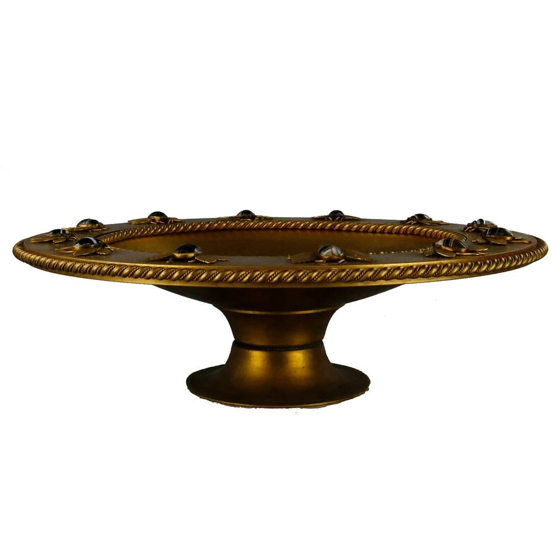 An antique Egyptian Revival tazza offers gilt bronze construction with rim having rope twist trim and applied carved agate scarabs in the form of insects, circa 1870.

Measures: 4