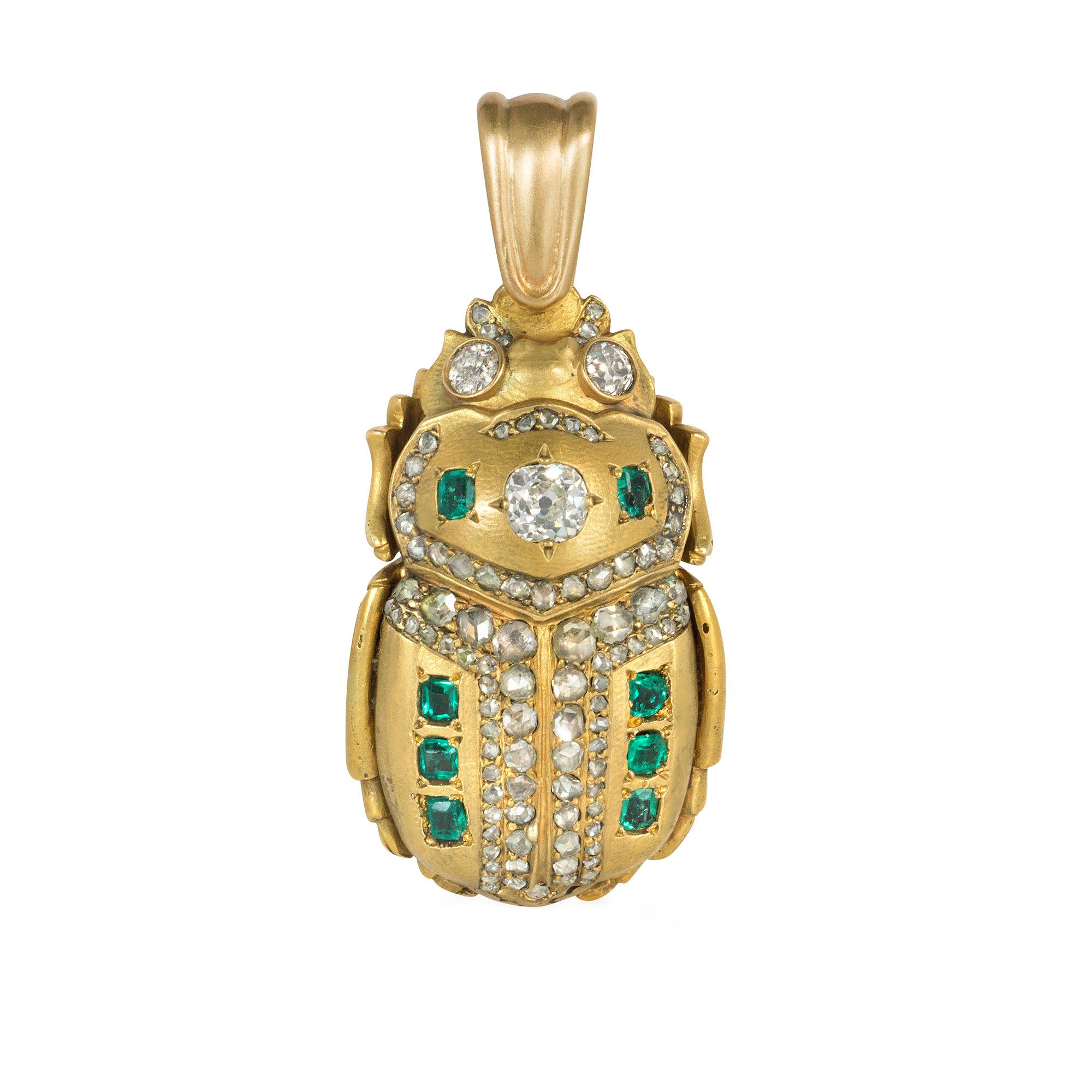 An antique Egyptian Revival convertible gold and gem-set pendant-brooch in the form of a scarab, the back adorned with emeralds and old-mine-cut, cushion-cut, and rose-cut diamonds, the legs and underside realistically rendered in gold, with