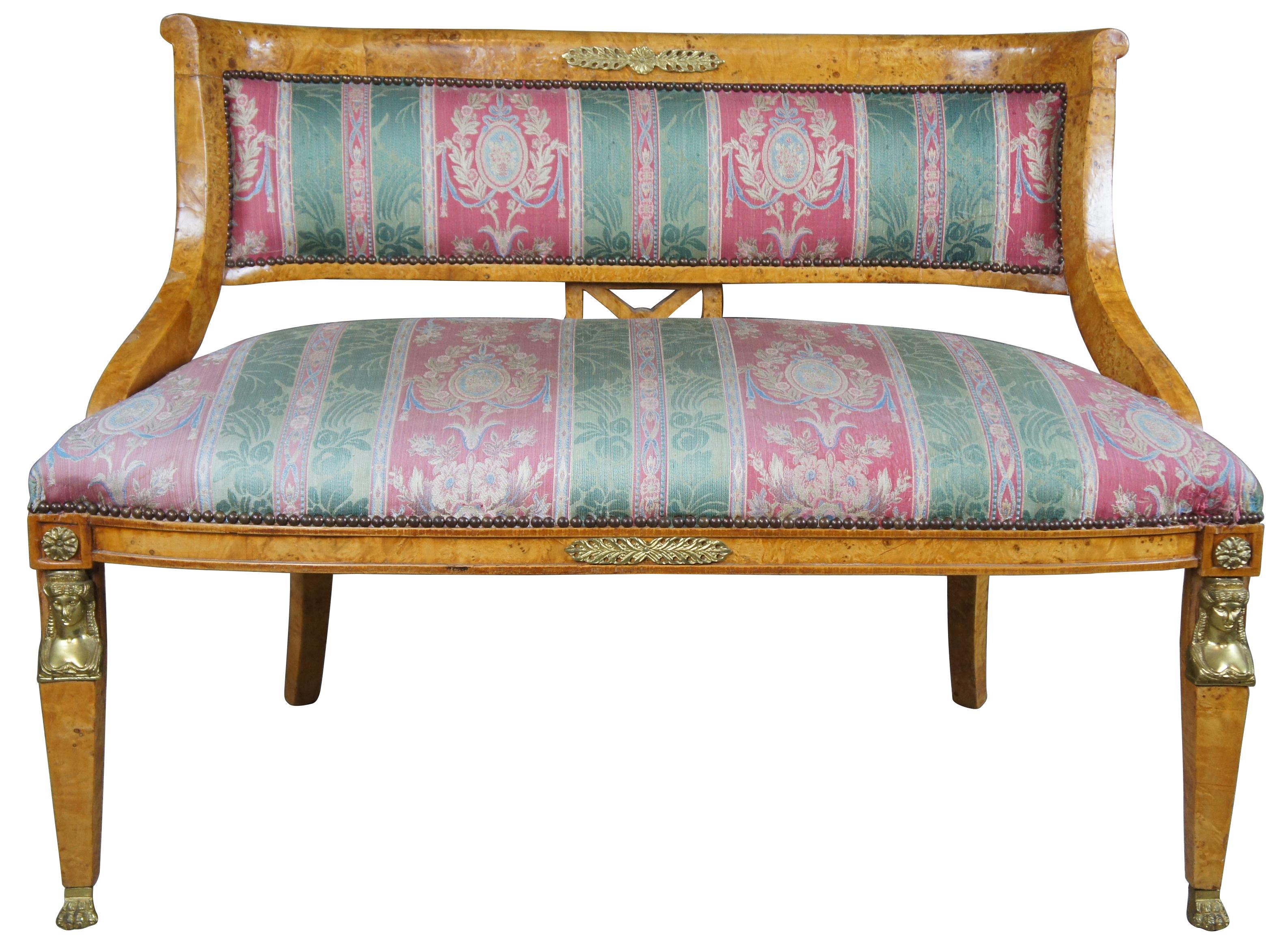 Monumental early 20th century parlor set. A neoclassical and Egyptian revival inspired design. Features a curved rail with unique X-back between contoured arms leading to regal striped upholstery. The chairs are supported by square tapered front