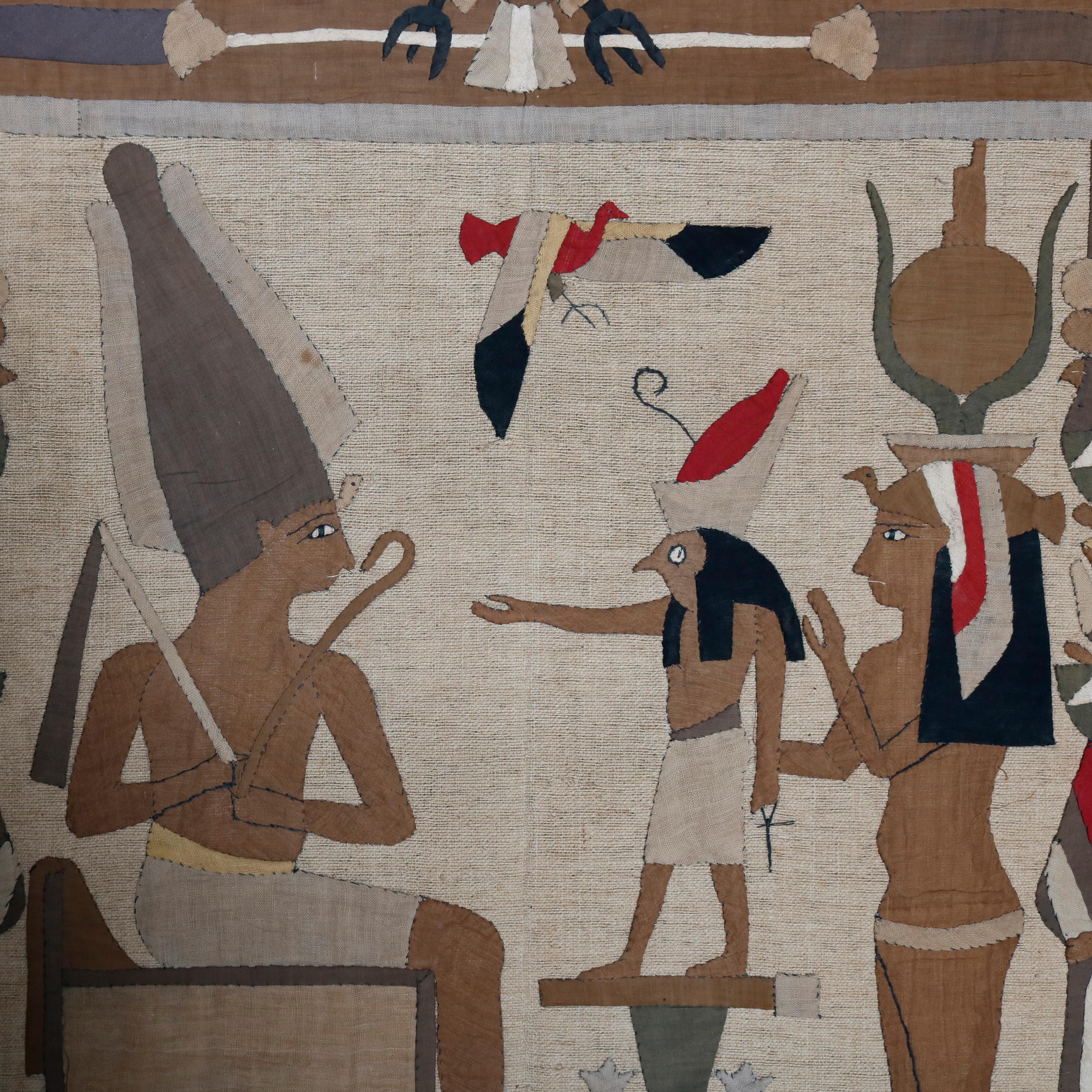 An antique Egypt Revival wall tapestry offers scene with figures making offering to king with birds and stylized flowers, circa 1920

***DELIVERY NOTICE – Due to COVID-19 we are employing NO-CONTACT PRACTICES in the transfer of purchased items. 