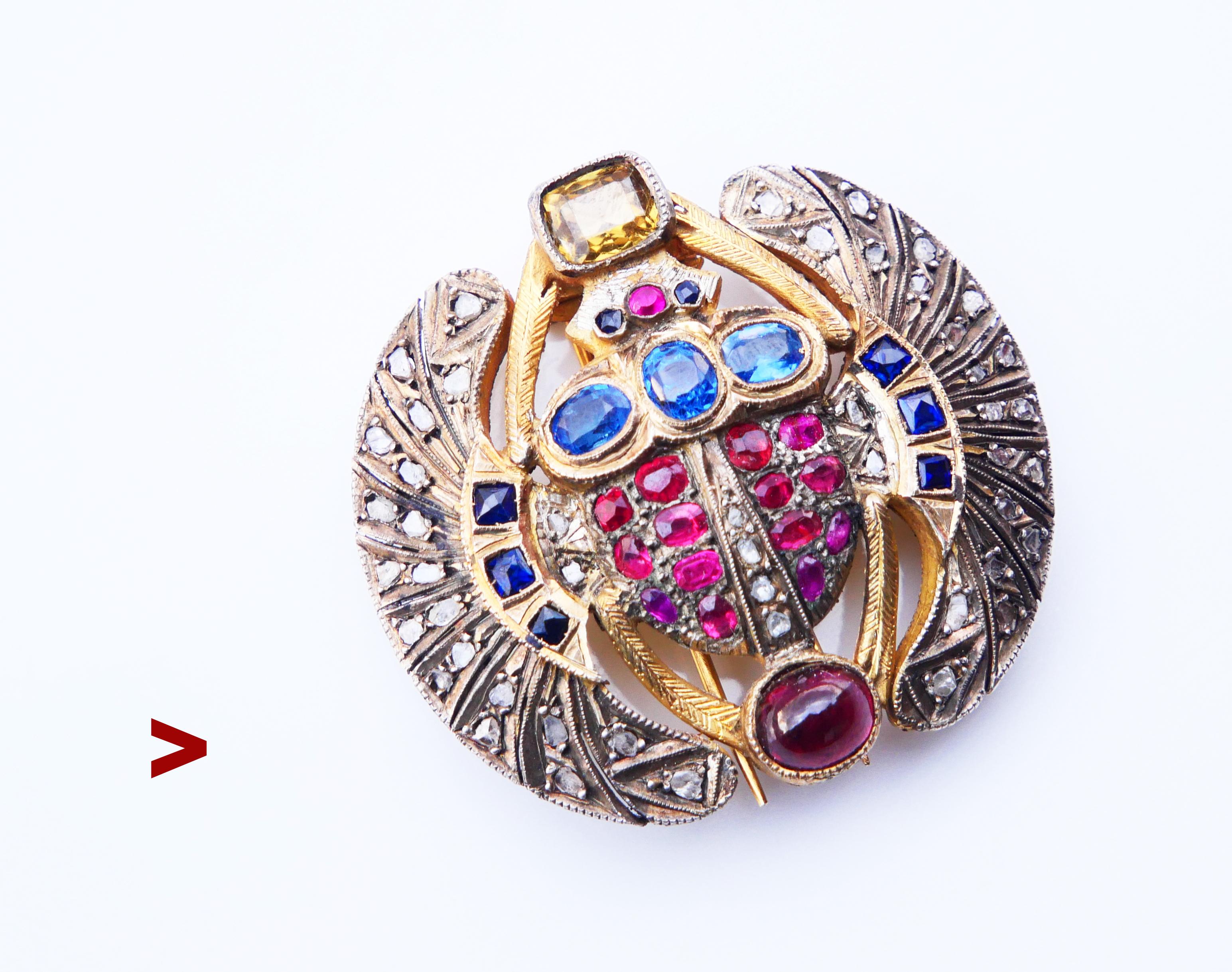 Antique Egyptian Revival sacred Scarab Beetle Brooch made of Gilt / Fold Filled Silver decorated with 15 natural Rubies, 11 natural Sapphires , 28 natural Diamonds, one Citrine and a Garnet stones. Firm clasp with two firm needles.

This brooch was