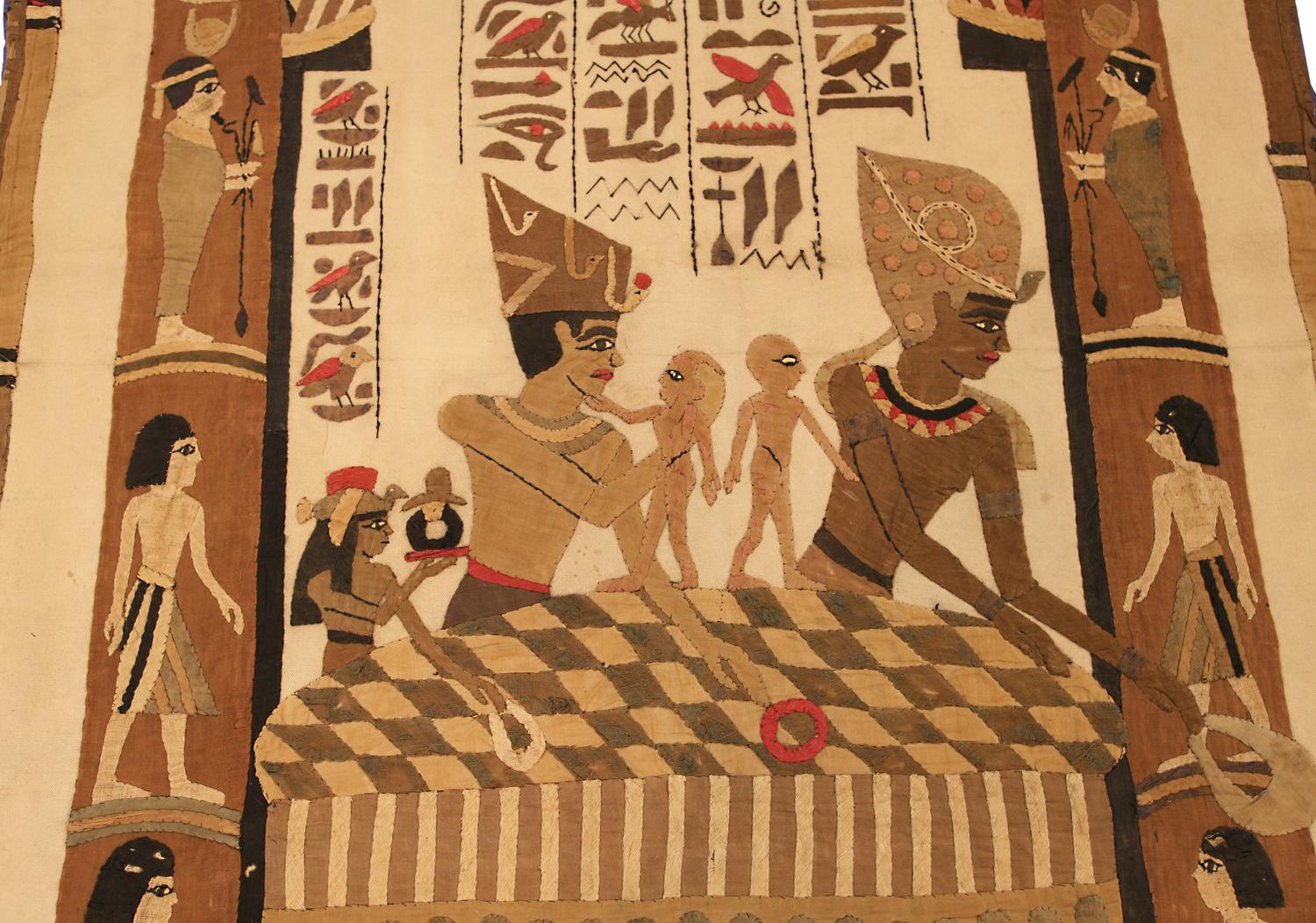 This is an antique Egyptian textile woven during the first quarter of the 20th century circa 1920s and measures 184 x 90cm in size. this textile depicts original drawings from ancient Egypt with many different figures, traditional motifs, and