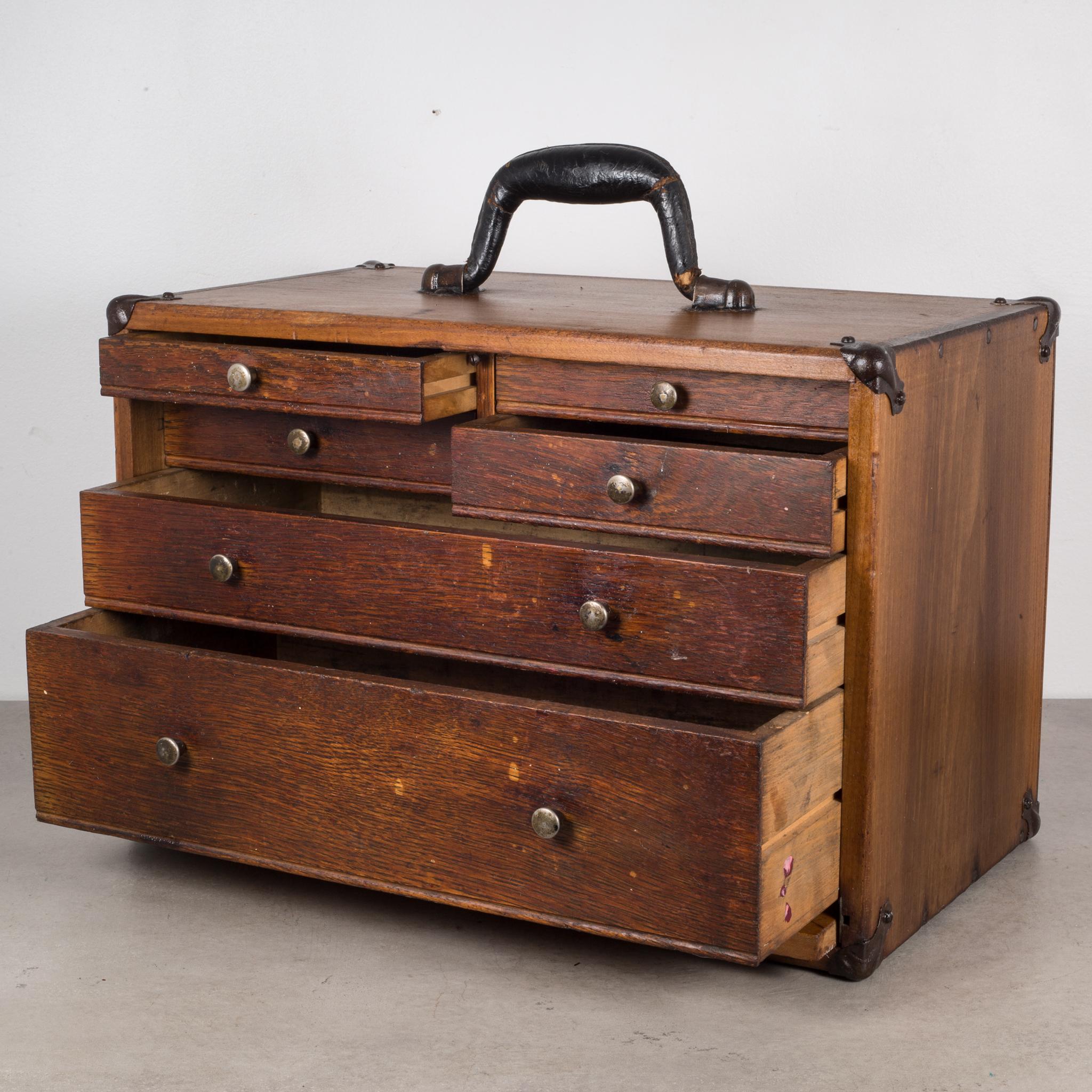 About

An oak machinist's chest with leather handle, eight graduated drawers, brass pulls, metal corners and a pull out front cover.

Creator Unknown.
Date of manufacture circa 1940s.
Materials and techniques oak, brass.
Condition good. Wear
