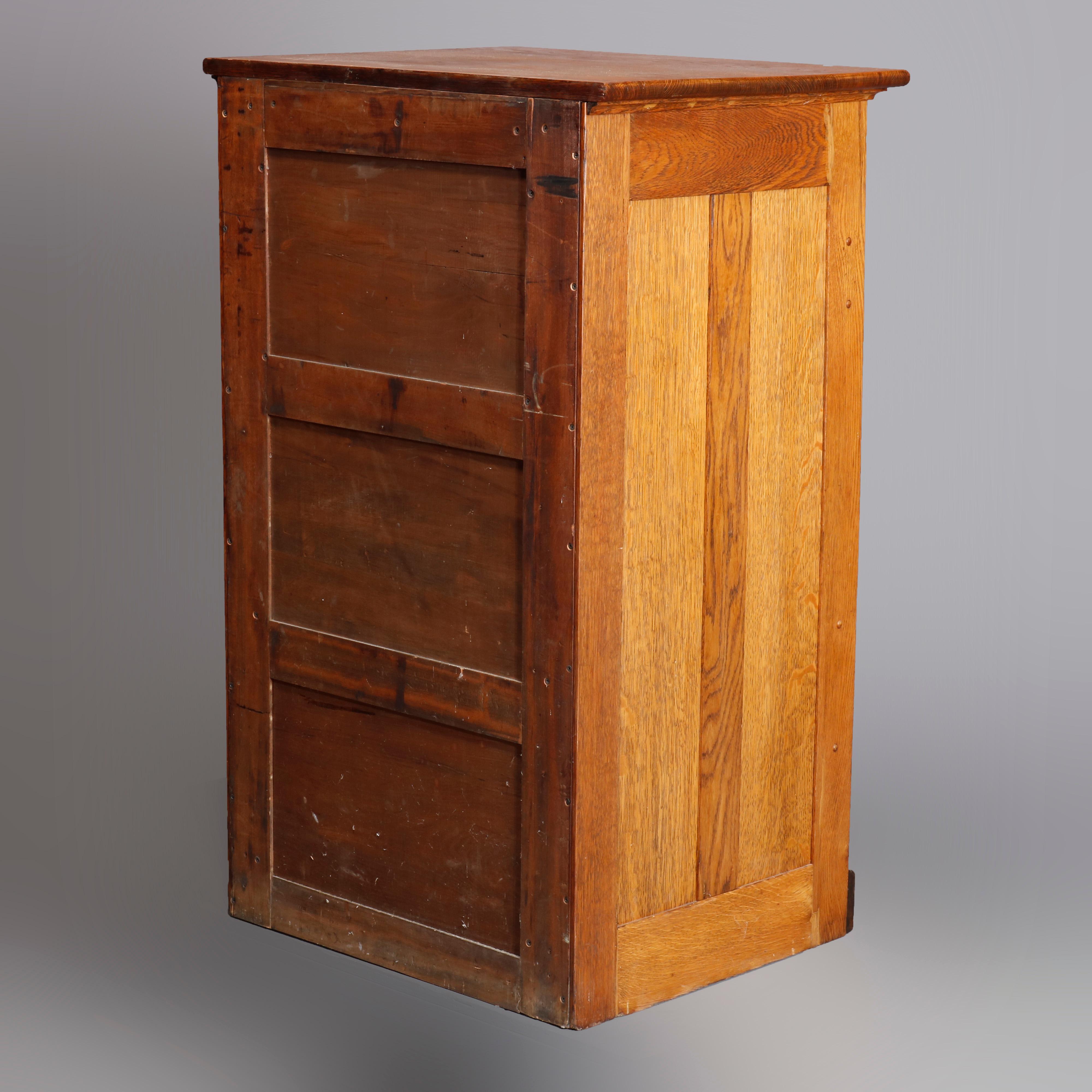 An antique map, art or print fining cabinet offers oak construction with eight drawers, brass pulls throughout, circa 1910

Measures- 45.5