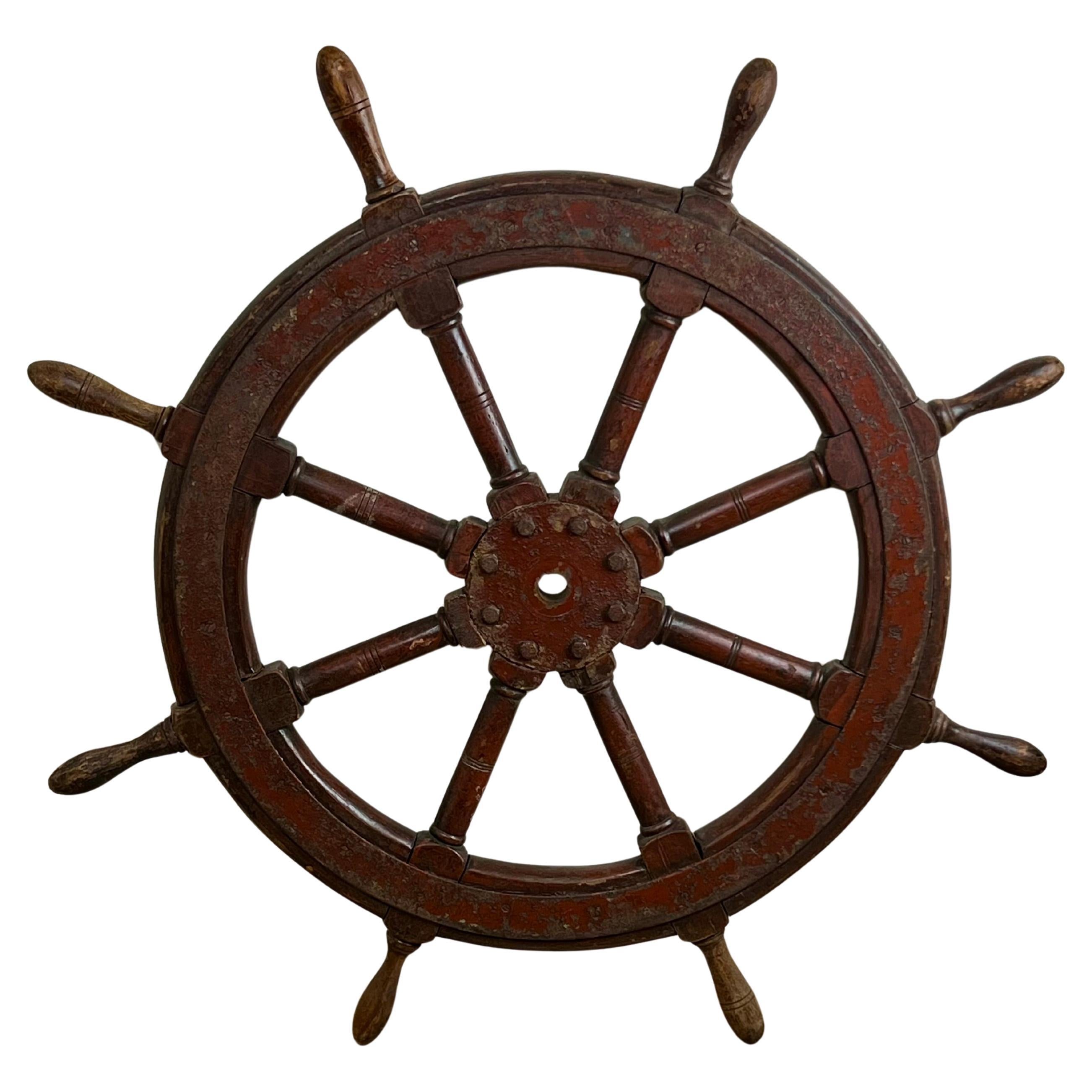 Roue de bateau ancienne à huit branches en acajou et en fer, estampillée "1864 US".