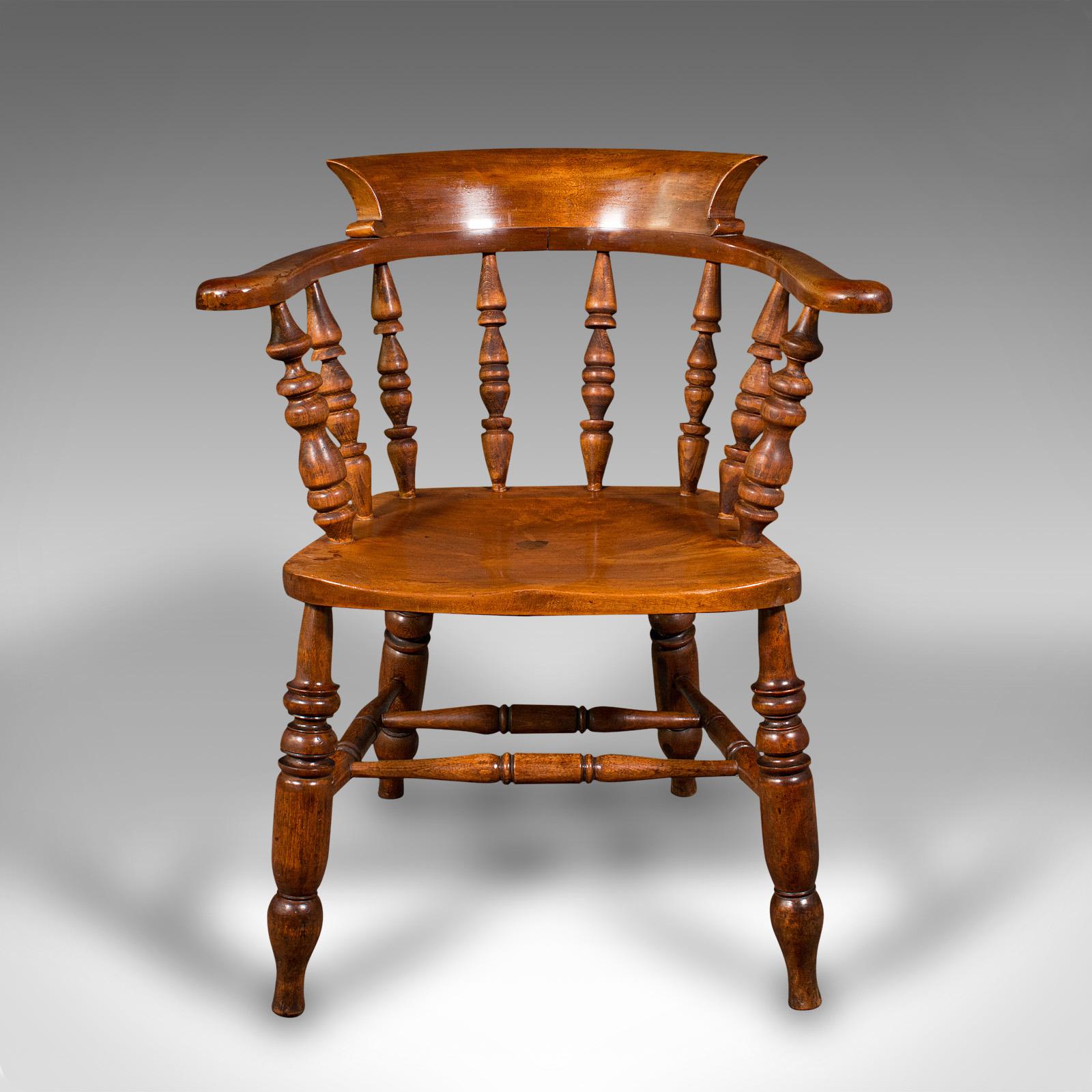 This is an antique elbow chair. An English, beech and fruitwood smoker's bow or captain's chair, dating to the late Victorian period, circa 1880.

Excellent country house appeal with the classic bow form
Displaying a desirable aged patina and in