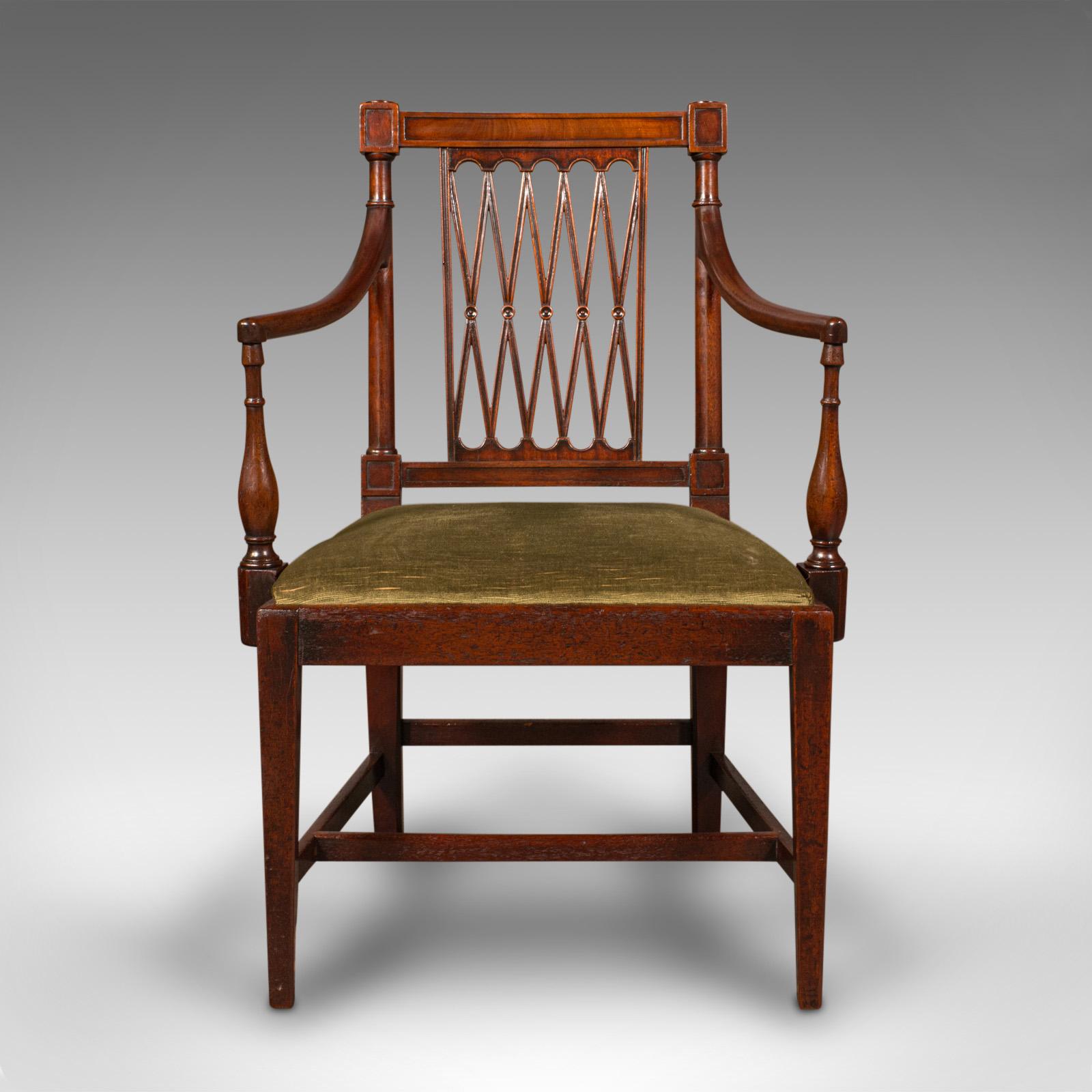 This is an antique elbow chair. An English, mahogany carver seat with Sheraton taste, dating to the Georgian period, circa 1780.

Wonderfully distinctive elbow chair with a superb back rest
Displays a desirable aged patina and in very good