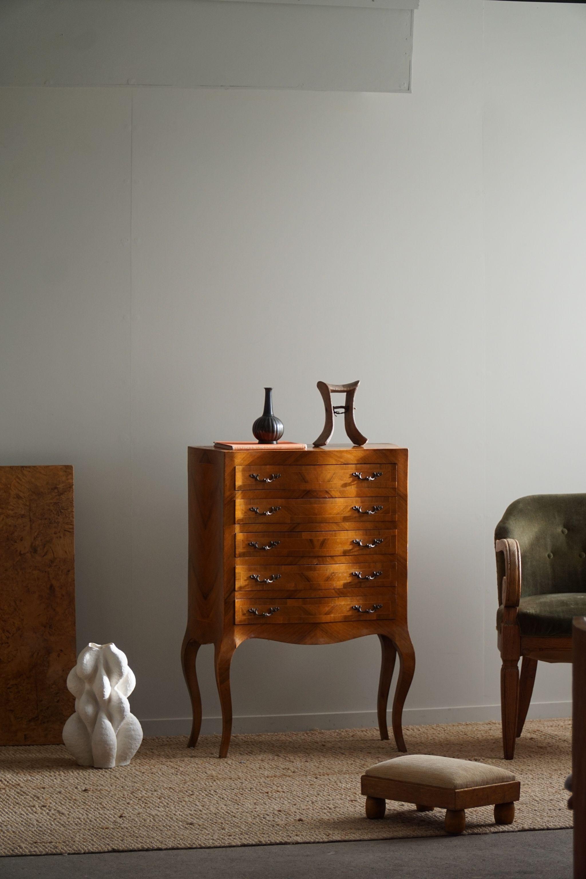 This small luxurious and elegant Antique Danish chiffonier with cabriole legs is a true testament to the exquisite craftsmanship of the late 19th century. Crafted from the rare and prized lemon tree wood, this piece exudes a unique charm that is