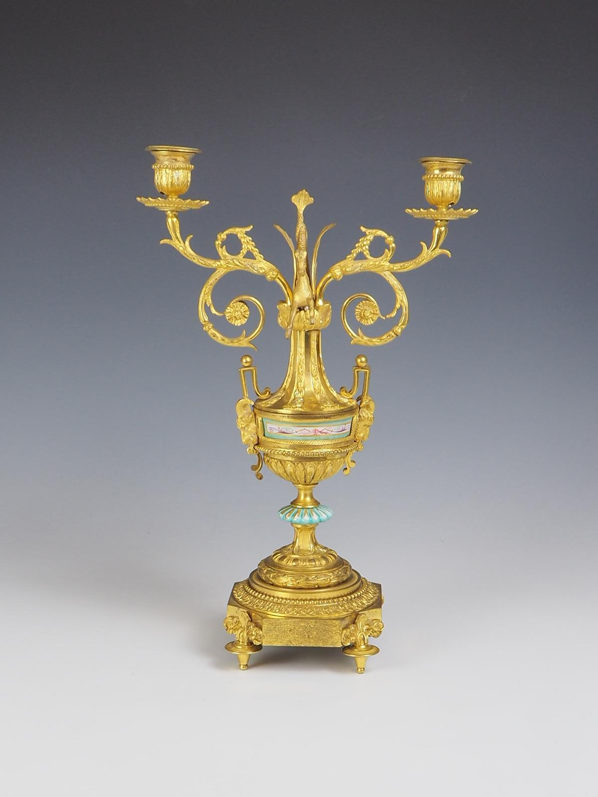 Antique Gilt Bronze Ormolu Candelabra is a truly exquisite piece that exudes elegance and sophistication.

Crafted with meticulous attention to detail, it features intricate horse and scroll details on its four raised feet, adding a touch of