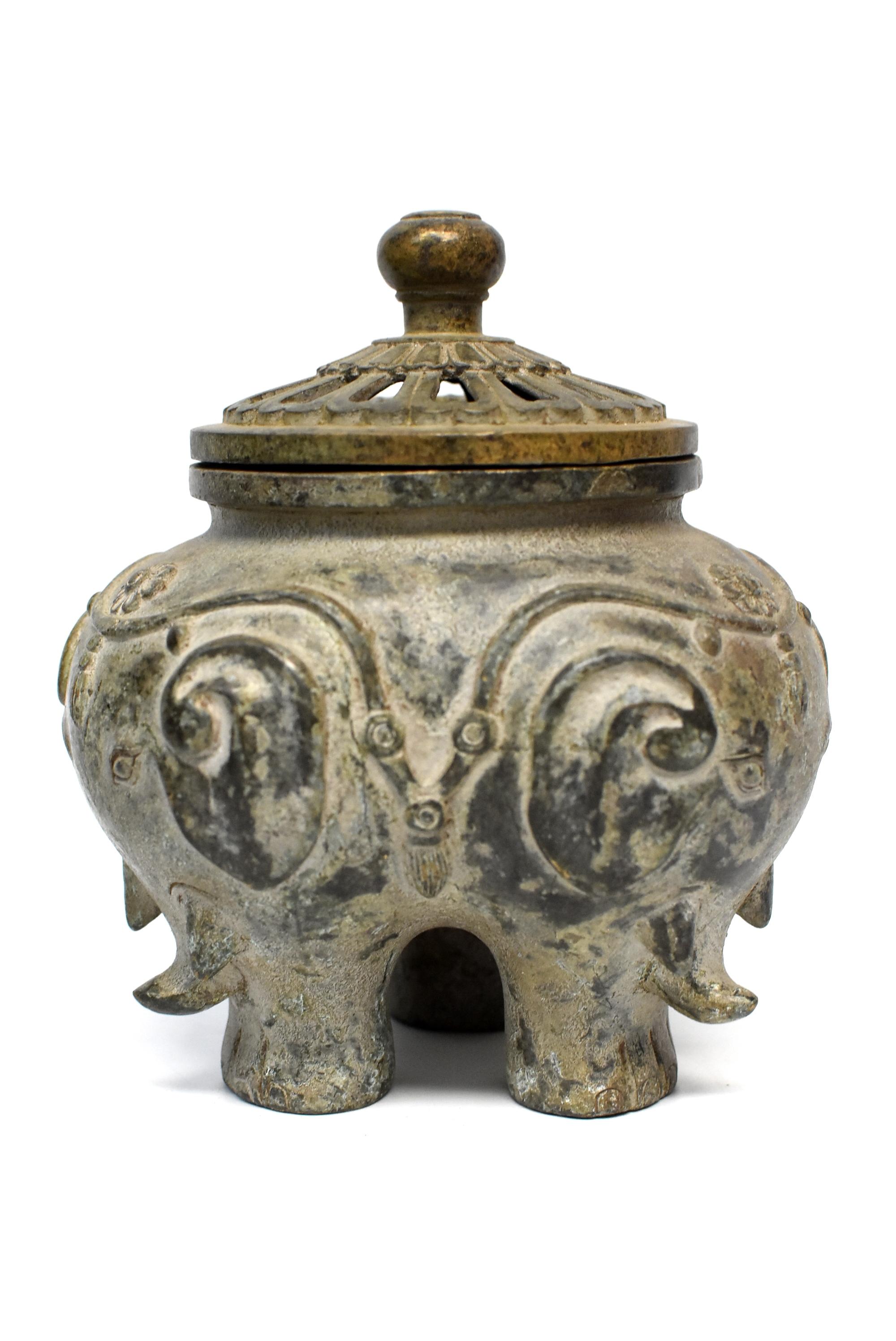 A beautiful, one of a kind, bronze incense burner featuring 3 elephants. The burner has a round lid with a Classic 