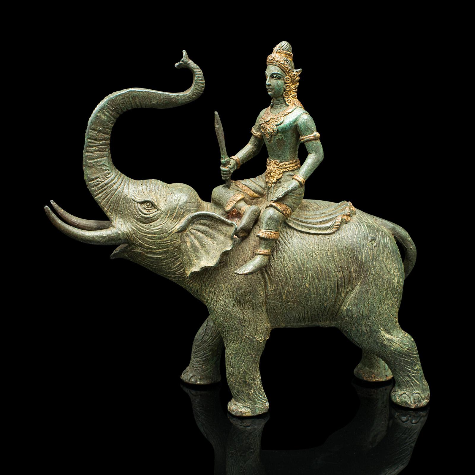 This is an antique elephant figure. An Asian, heavy bronze ornament with mounted Thai deity, dating to the late Victorian period, circa 1880.

Superb antique figure with seated deity
Displays a desirable aged patina and in good order
Substantial
