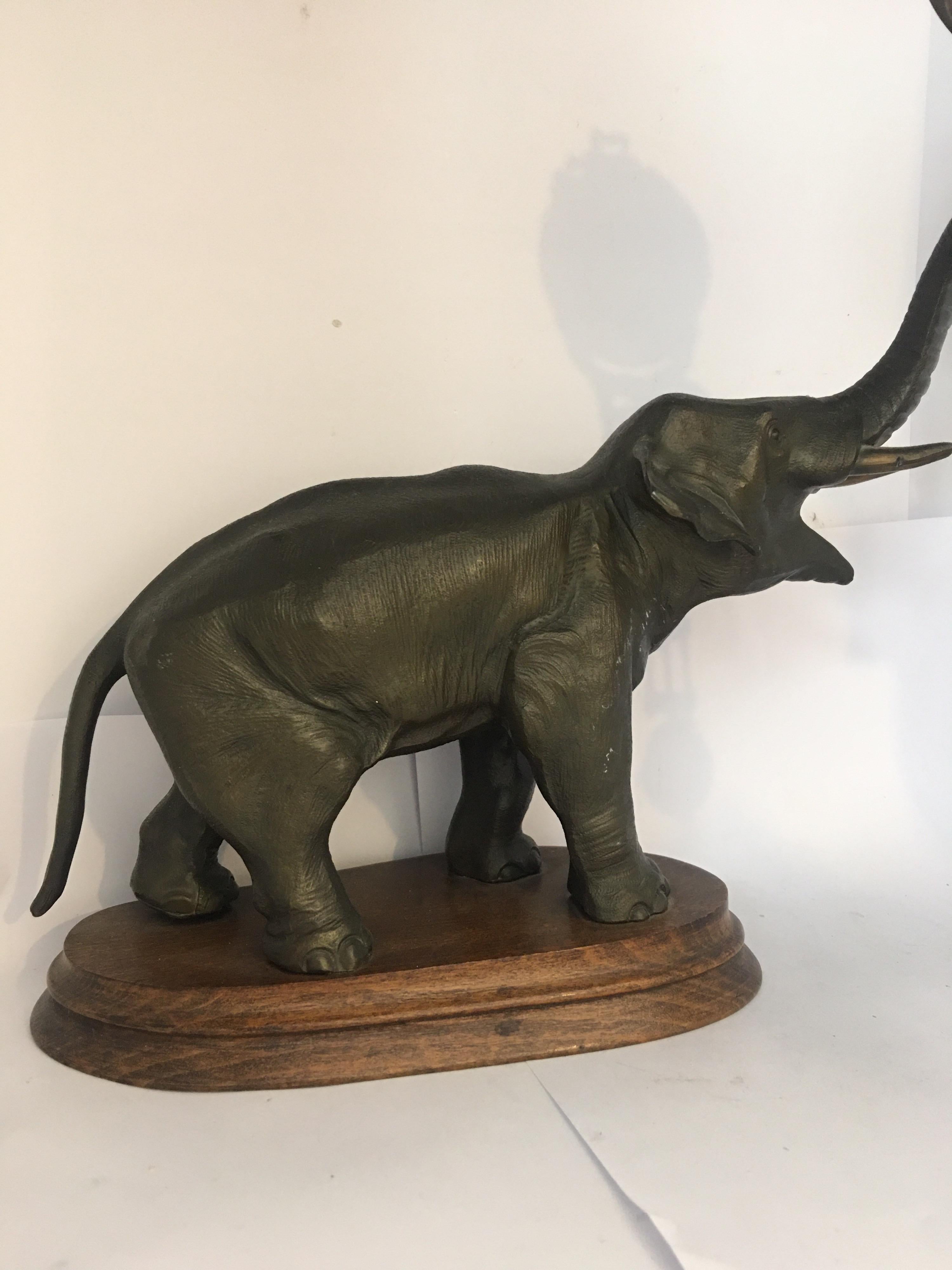 This beautiful antique bronzed elephant swinging clock is in good condition. Visible signs of ageing and wear as shown. Please study the images carefully as form part of the description.