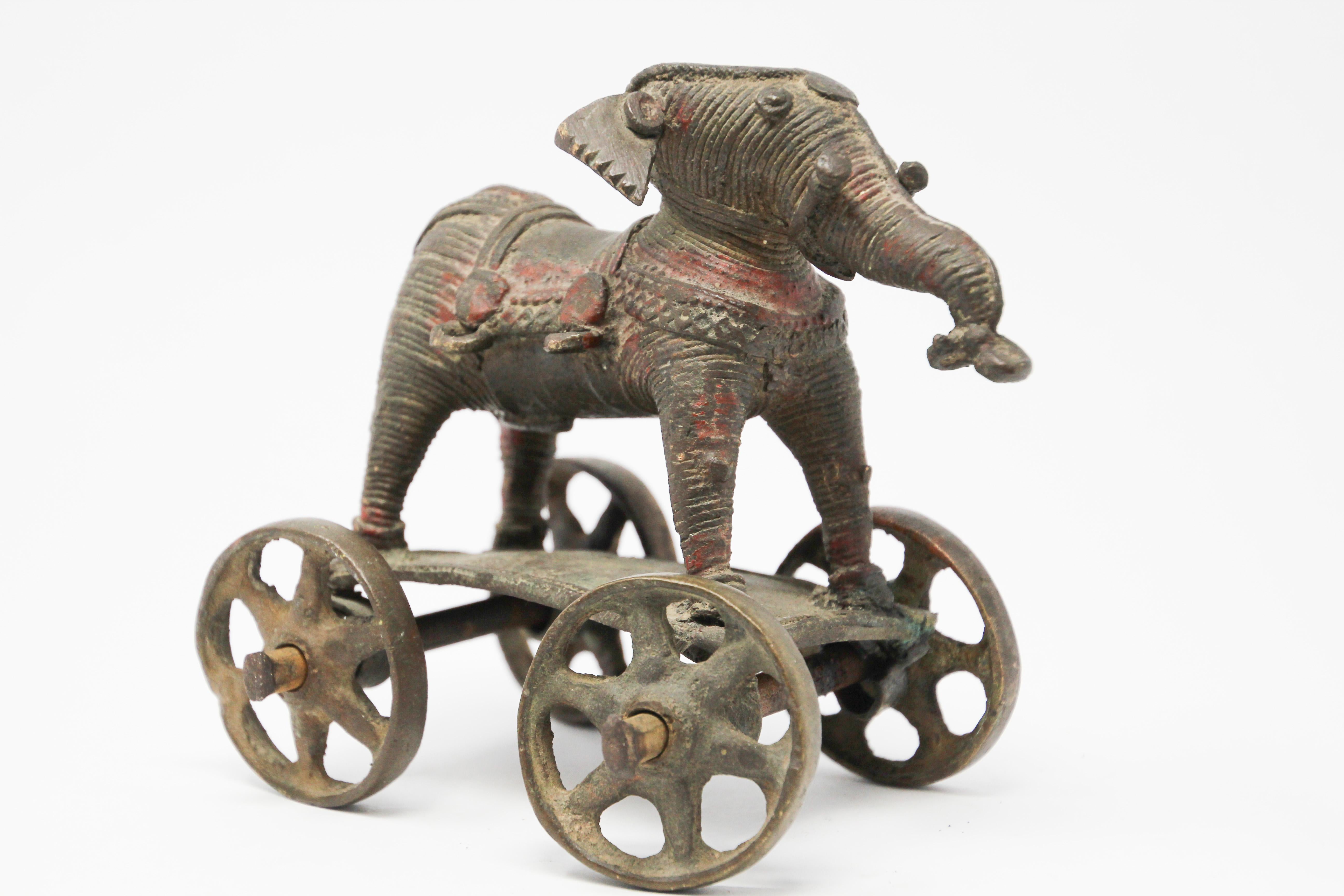 Antique cast bronze elephant temple toy on wheels from India.
This beautifully patinated brass temple elephant on wheels is from Bhundi in Rajasthan.
This would look perfect on a desk and is heavy enough to use as a paperweight
19th century Hindu