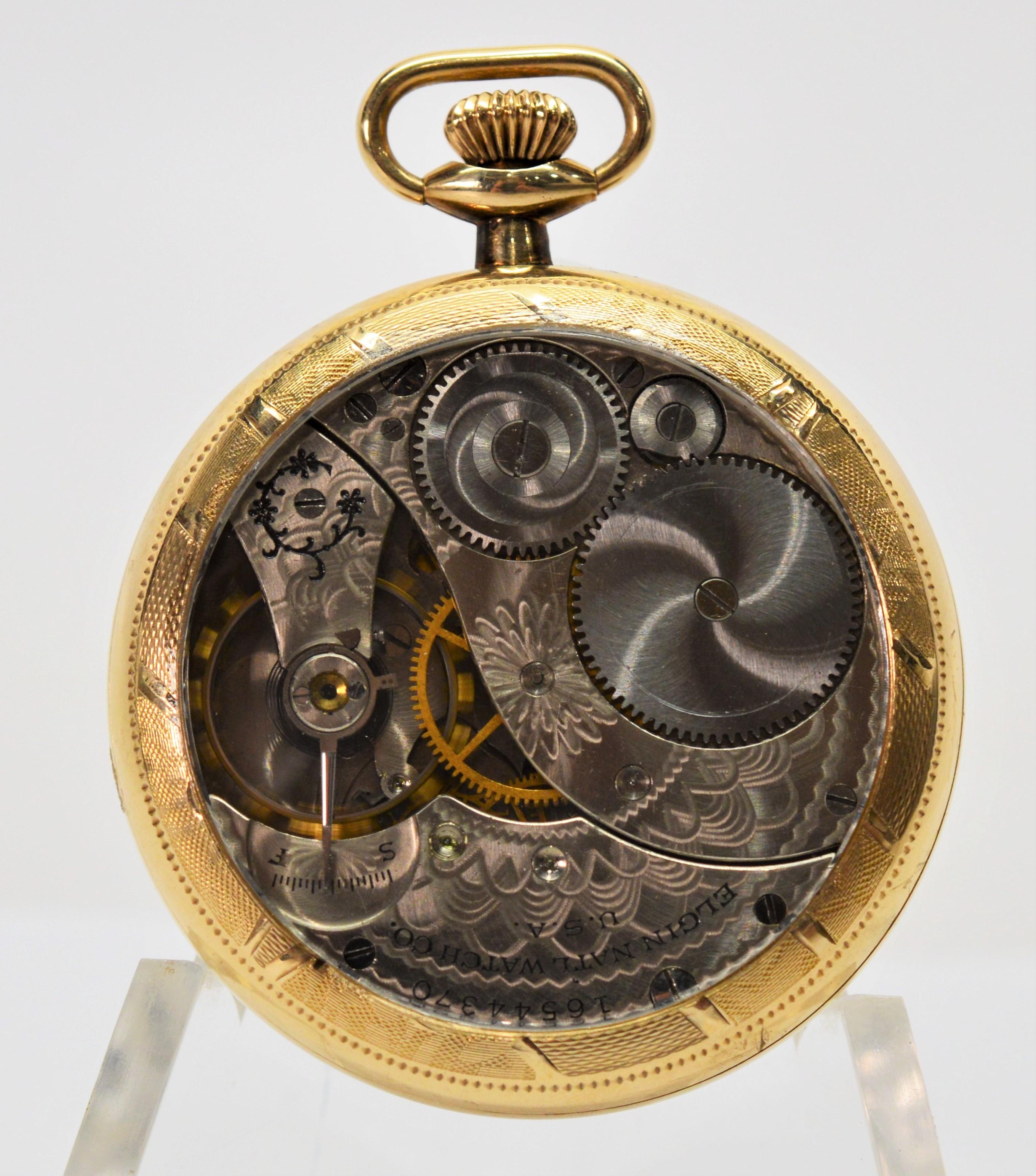 By Elgin National Watch Co., this circa 1912 American made brass pocket watch model #303 has been restored with a display back for a mesmerizing view of its beautiful fancy acid etched seven jewel movement. In watch size 12S ( approximately 1 3/4