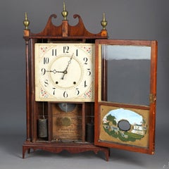 Antiguo reloj de manto de caoba con columna y volutas Eli Terry y panel eglomise C1830