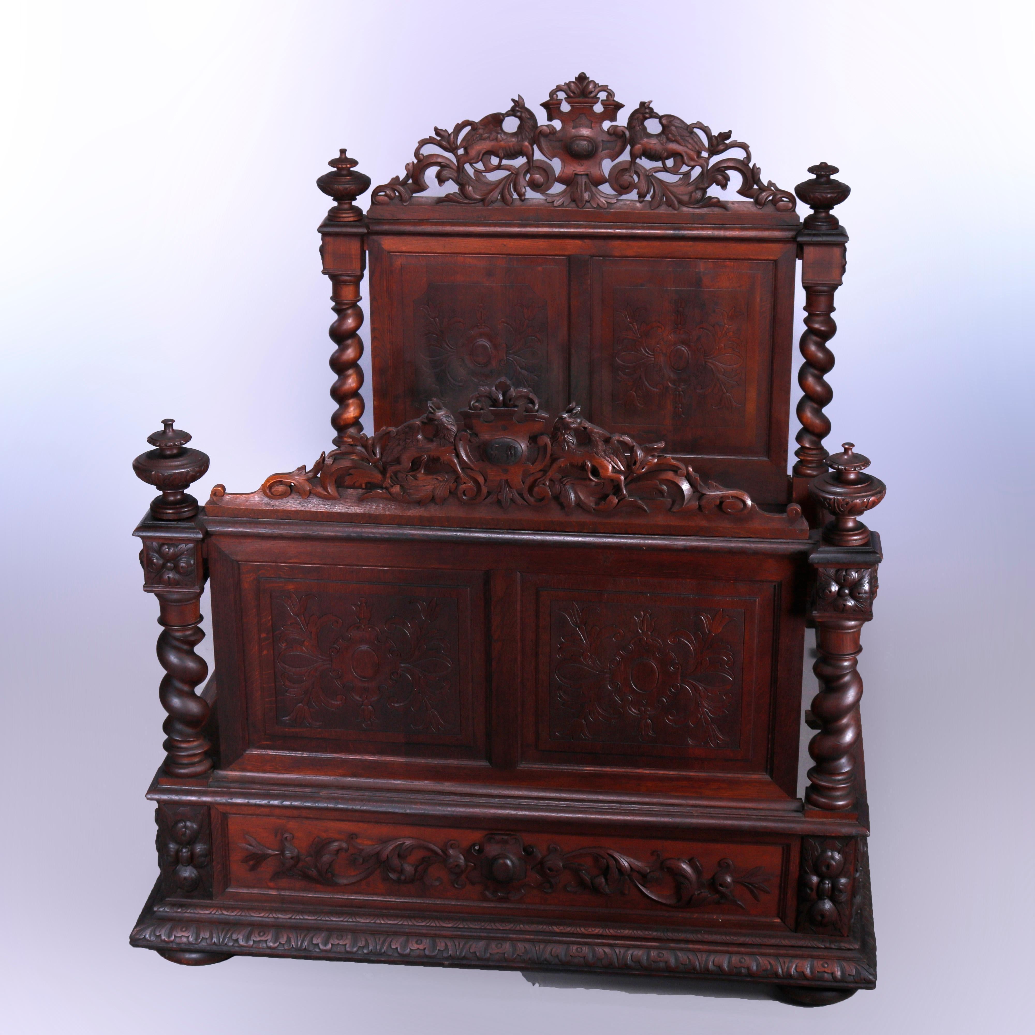 An antique English Elizabethan figural full size bed offers oak construction with carved and pierced crest having foliate elements and flanking griffIns over head and foot boards with raised panels having central shield and flowers, flanking rope