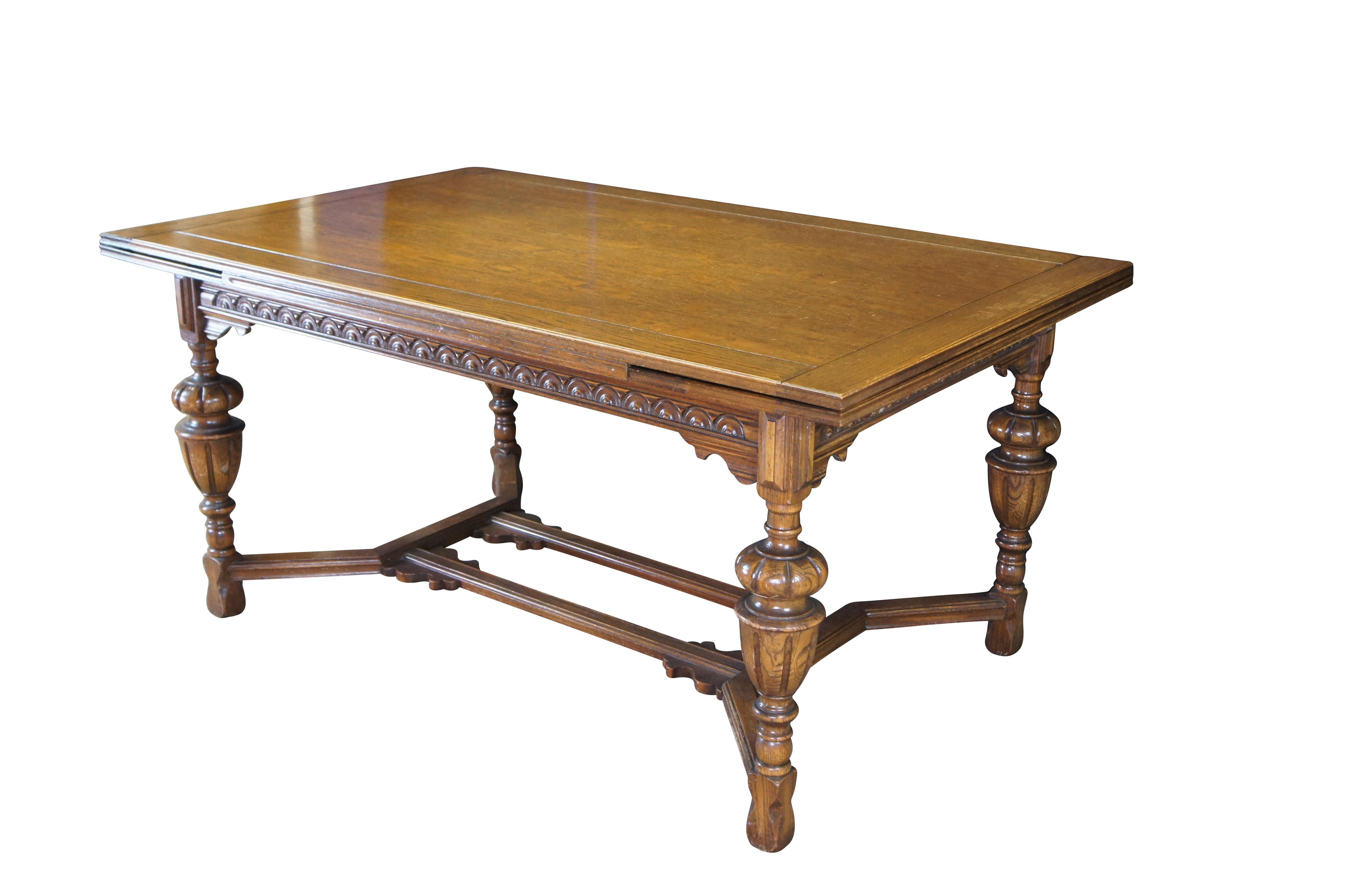 An Impressive early 20th century Elizabethan or Jacobean style Oak Draw-Leaf table. Features a rectangular plank top with pull-out leaves on each end, Bulbous carved legs and notched feet connected by stretchers.

Dimensions:
64