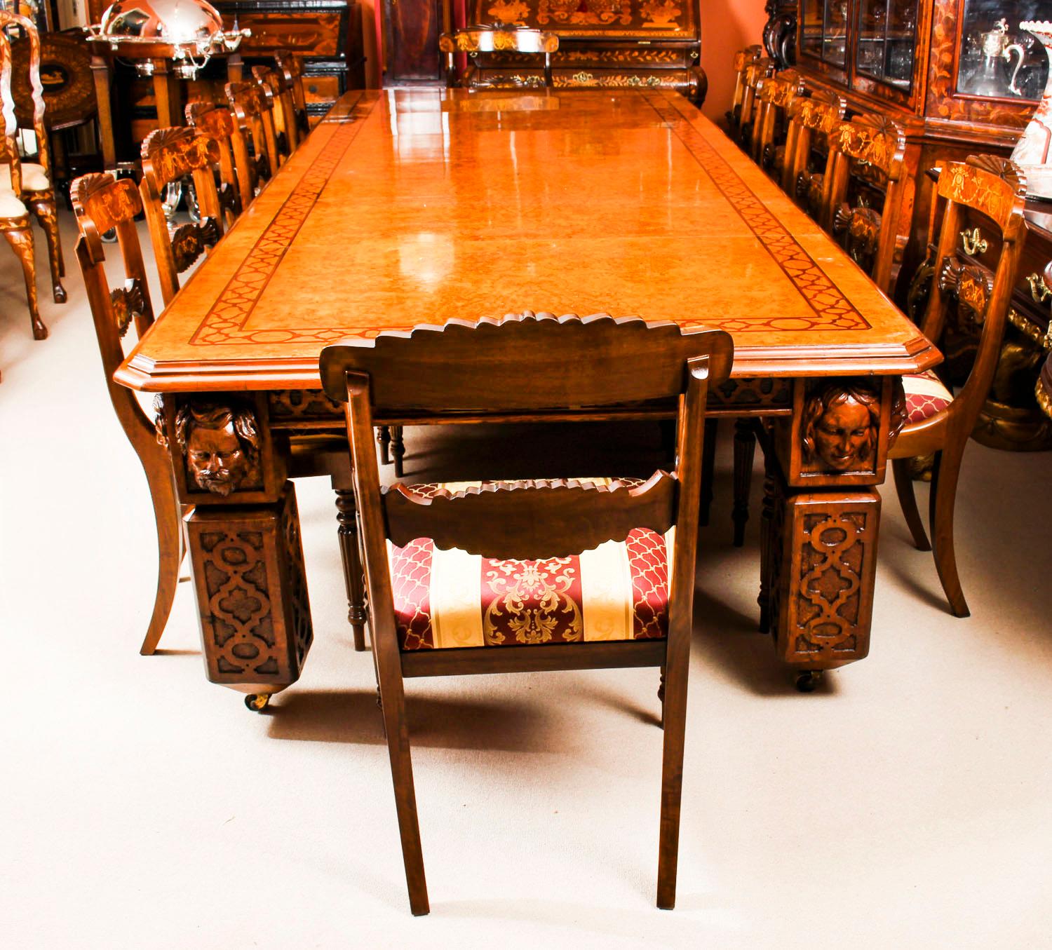 There is no mistaking the style and sophisticated design of this dining set comprising an exquisite rare English antique Elizabethan Revival pollard oak extending dining table, circa 1850 in date and a set of fourteen vintage dining chairs.

The