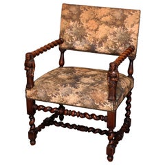 Antique Elizabethan Style Figural Carved Mahogany and Upholstered Armchair