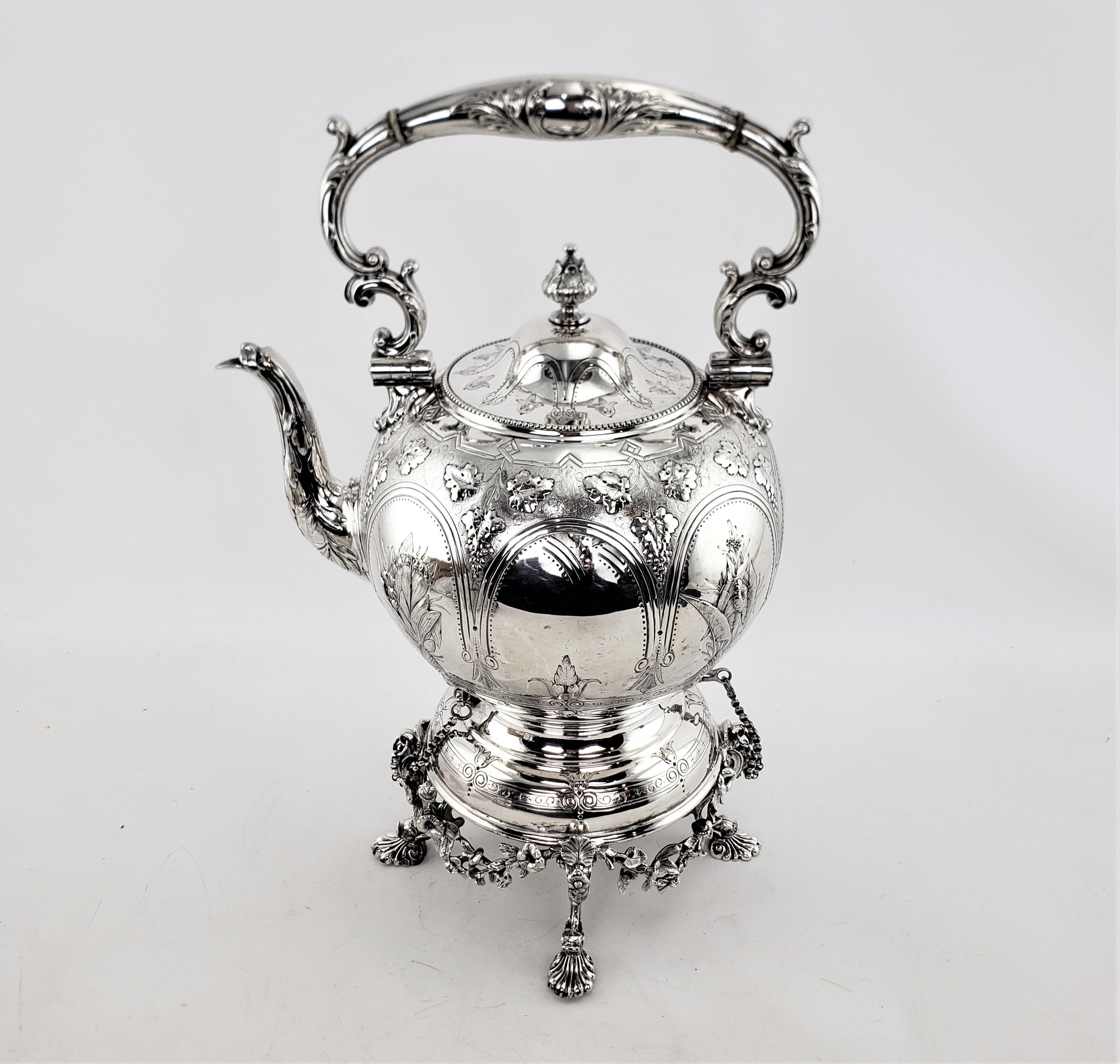 This antique spirit kettle was made by the well known Elkington & Co. of England in approximately 1880 and done in the period Victorian style. The kettle and stand are done in silver plate with a very sturdy construction and the kettle has a hinged