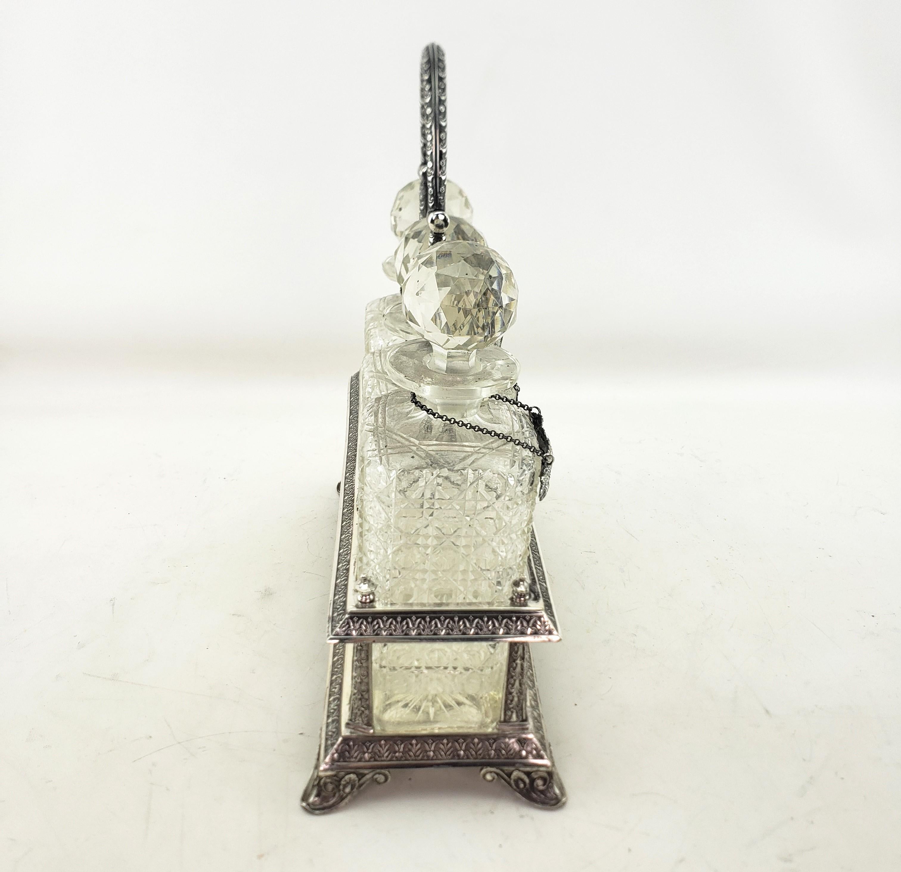 English Antique Elkington Silver Plated Tantalus with 3 Cut Crystal Liquor Decanters For Sale