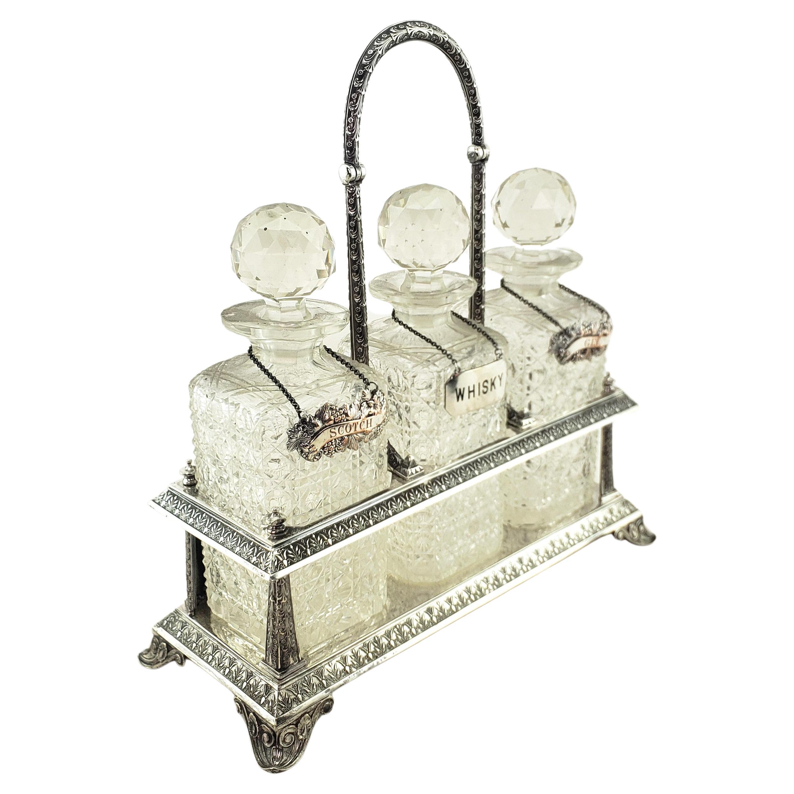 Antique Elkington Silver Plated Tantalus with 3 Cut Crystal Liquor Decanters For Sale